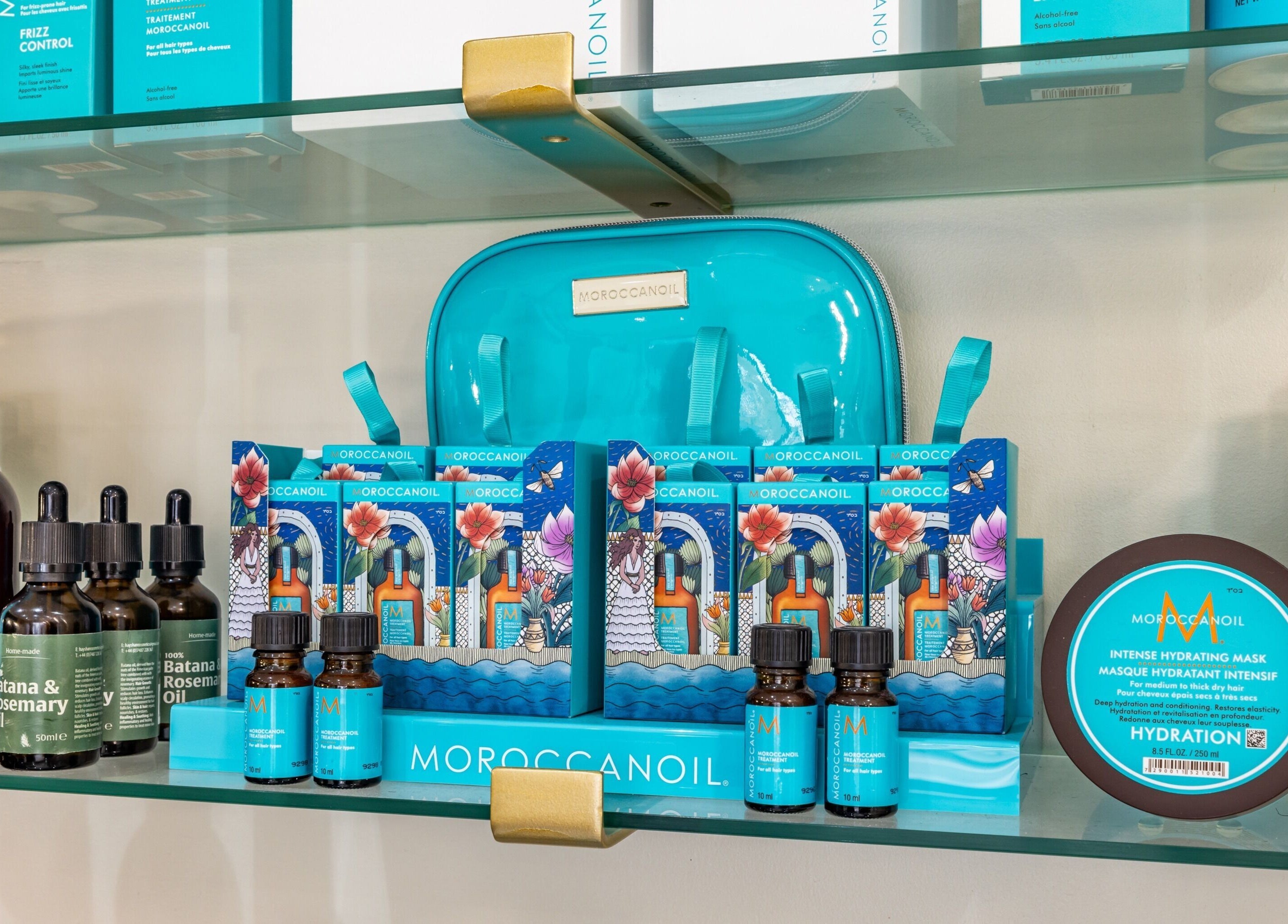 Moroccanoil products on a shelf at ATH Studios in Croydon, England, GB, showcasing hair care essentials.