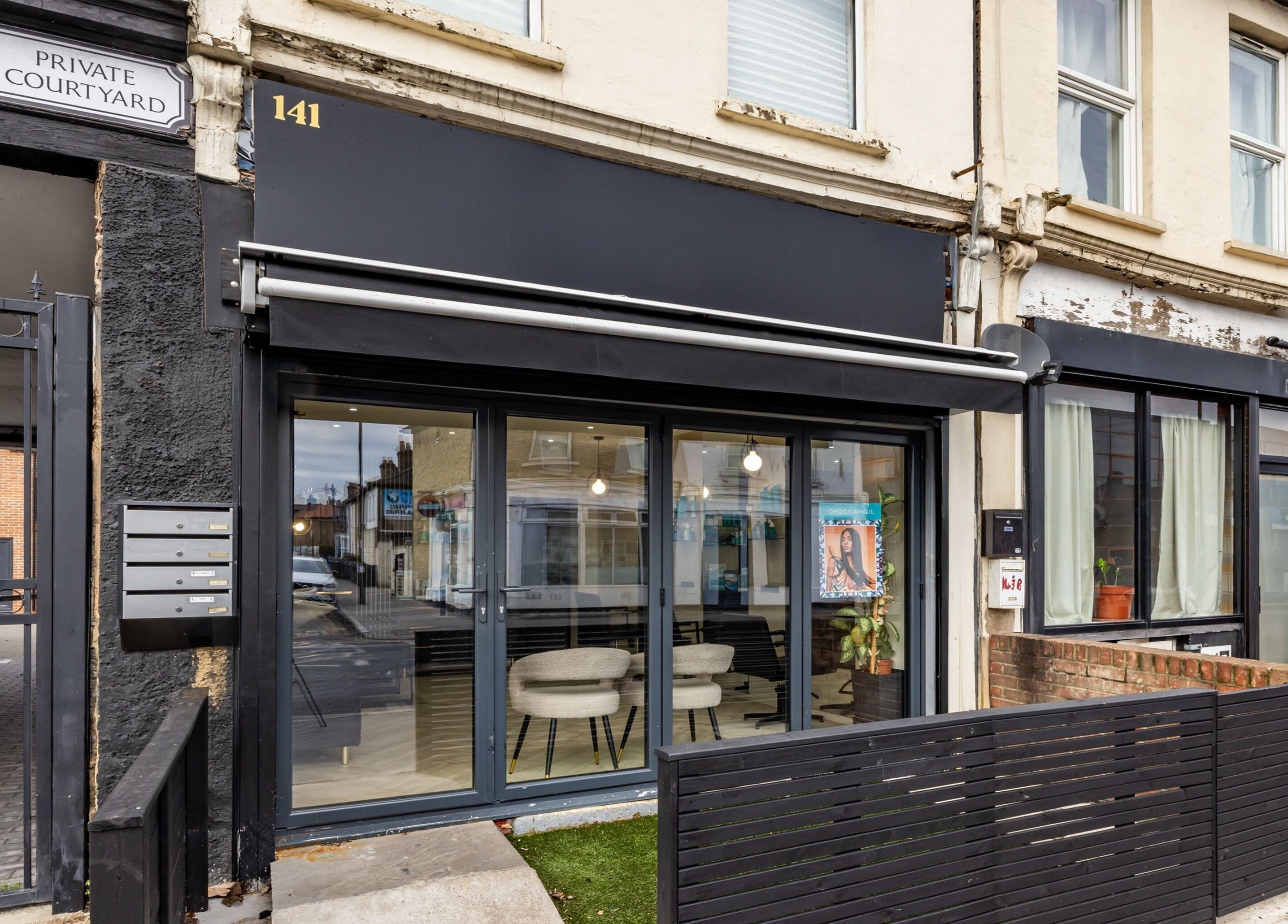 Exterior view of ATH Studios in Croydon, England, GB showcasing modern black facade and large windows.