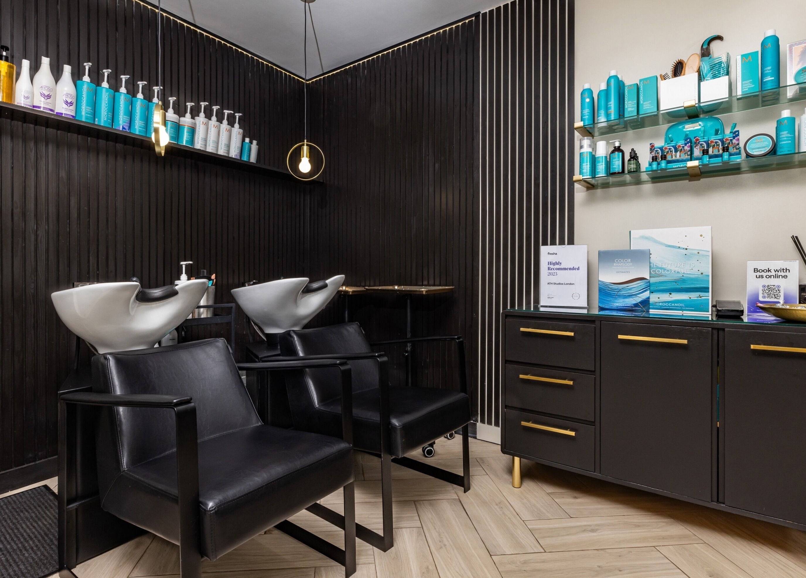 Modern wash stations and product display at ATH Studios, Croydon, England, GB showcasing a chic, professional atmosphere.