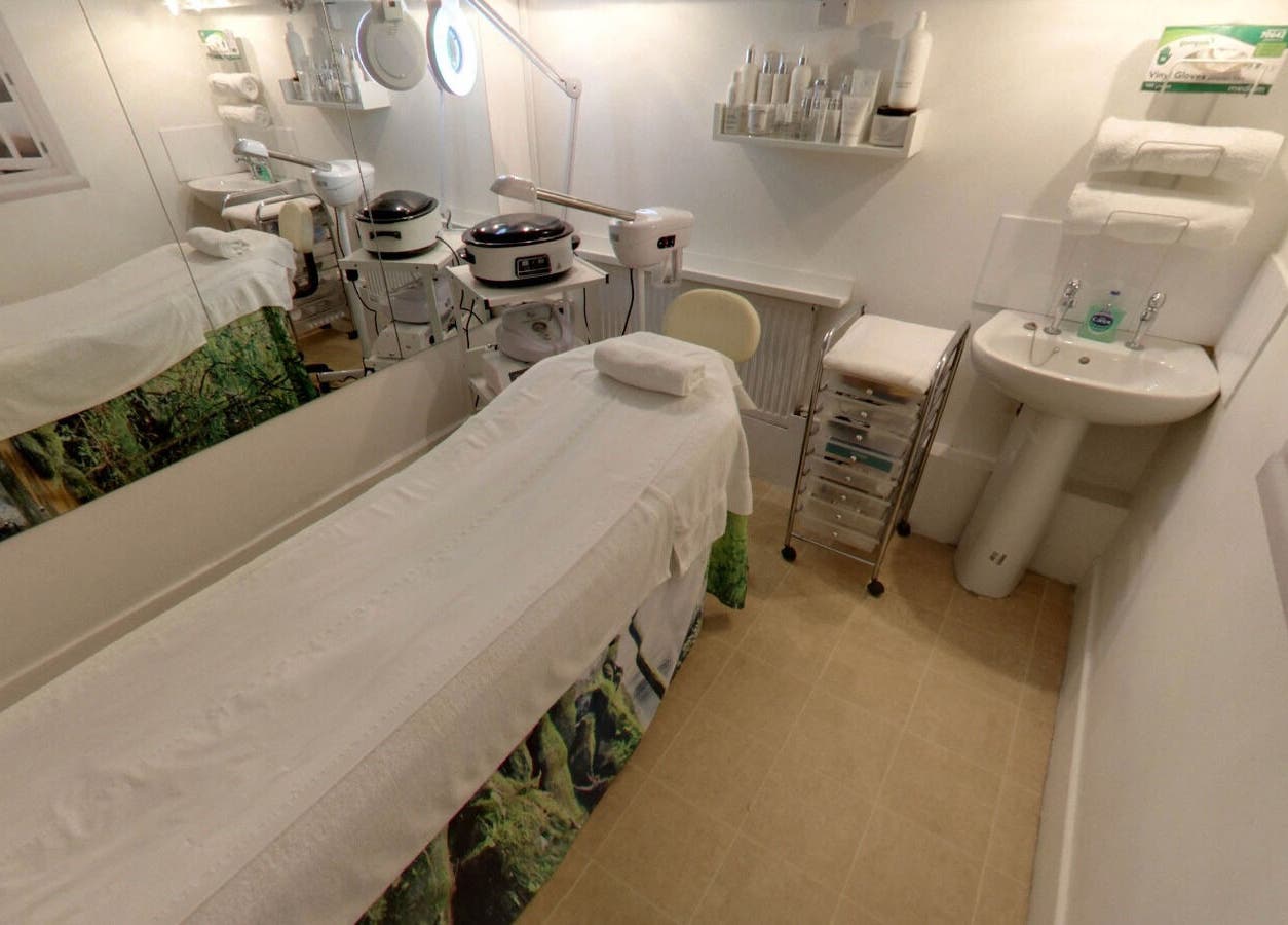 Treatment room at Laserlite Aesthetic Clinic, Croydon, England, GB. Features modern equipment and calming decor.