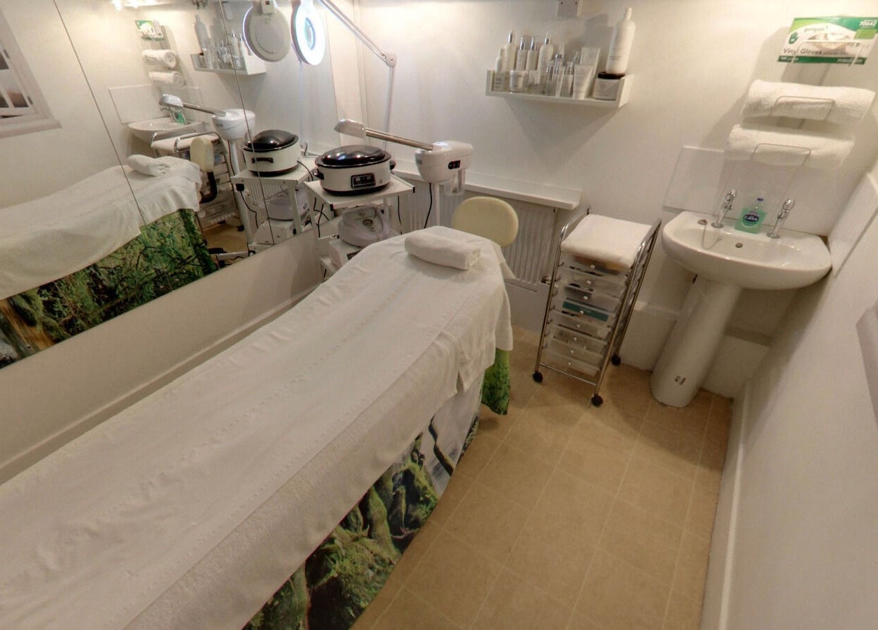 Treatment room at Laserlite Aesthetic Clinic, Croydon, England, GB. Features modern equipment and calming decor.