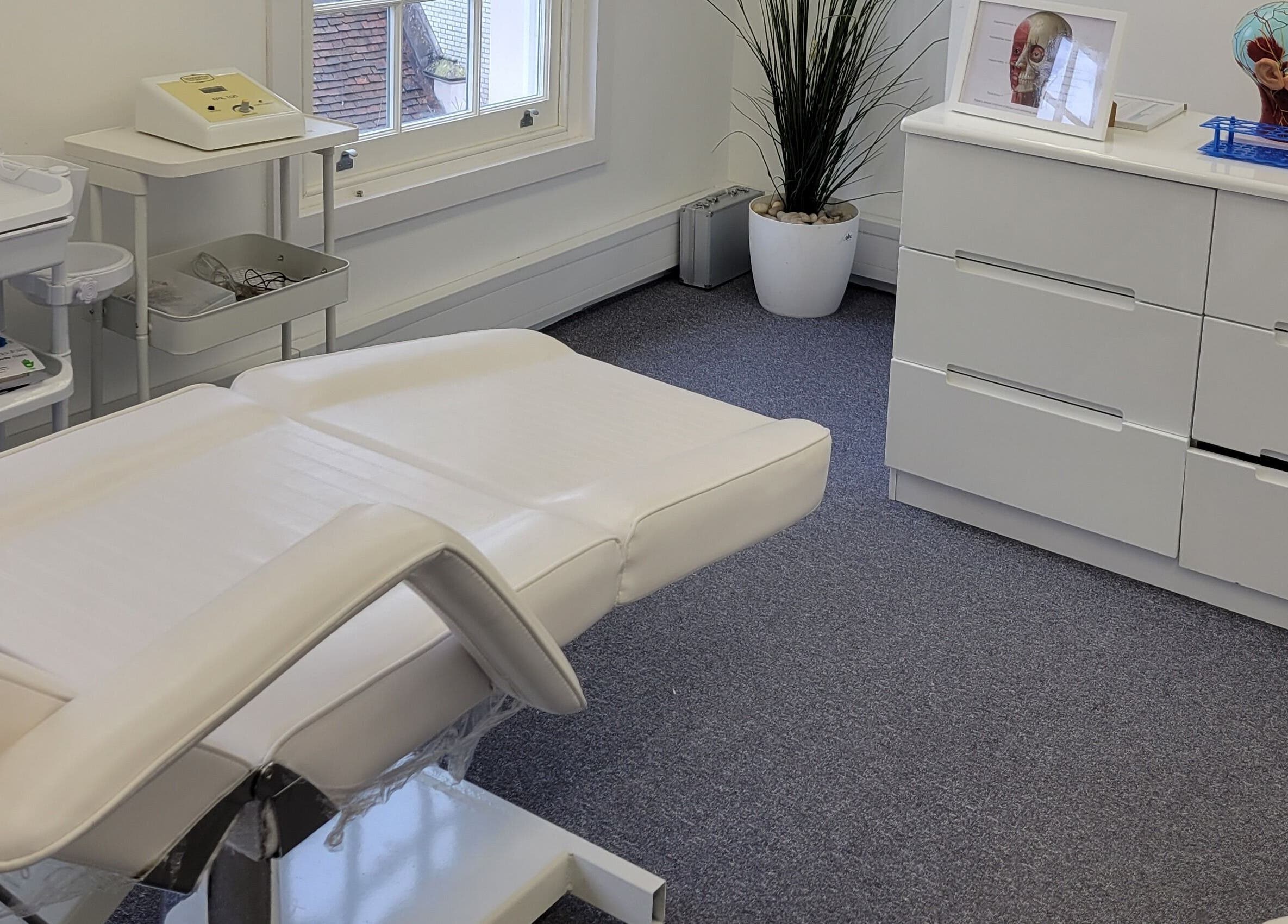 Serene treatment room at Laserlite Aesthetic Clinic in Croydon, England, GB, showcasing a modern setup.