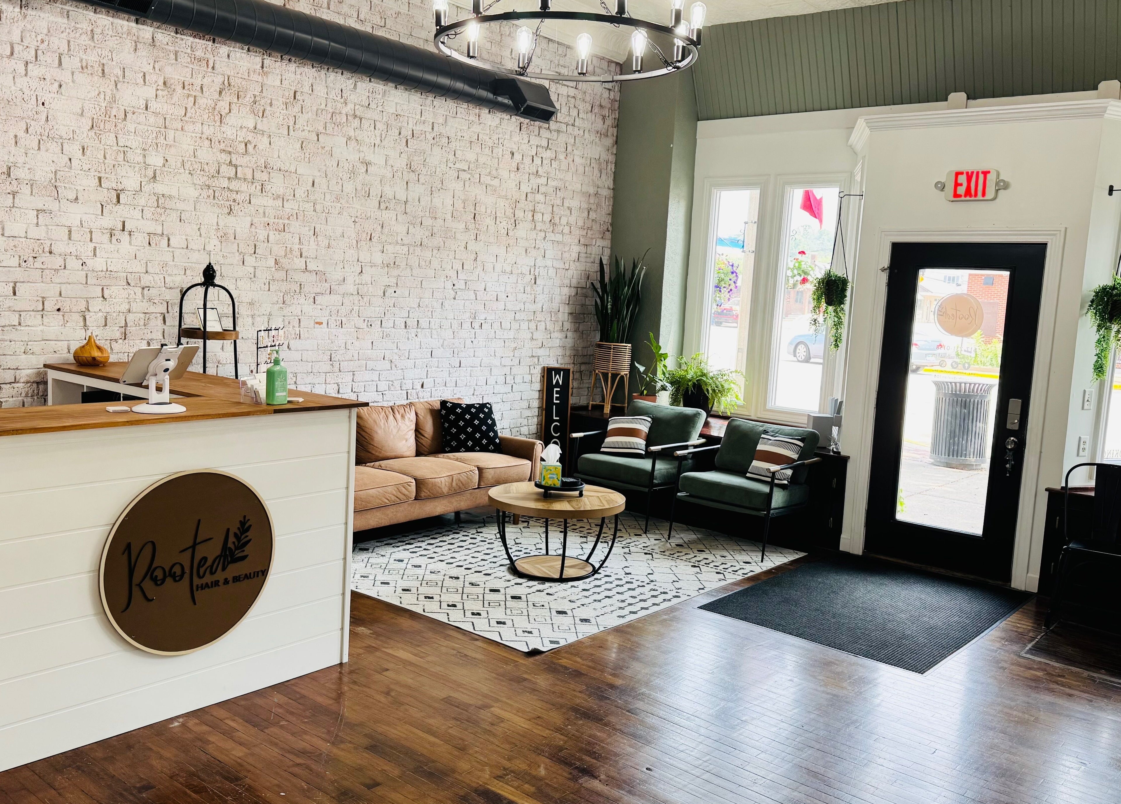 Welcoming interior of Rooted Salon with stylish seating in Eaton Rapids, Michigan, US.