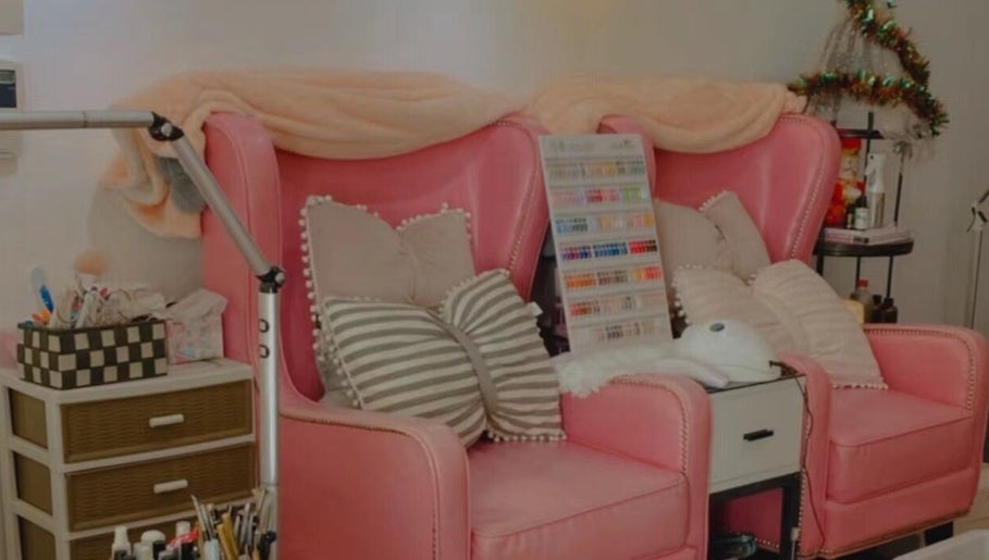 Pink salon chairs with pillows at Colorful Unicorn SG, Singapore, SG, offering a cozy, stylish beauty setting.