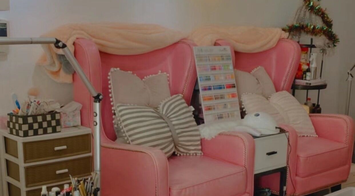 Pink salon chairs with pillows at Colorful Unicorn SG, Singapore, SG, offering a cozy, stylish beauty setting.