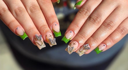 Stylish butterfly nail art with green tips at Chloe Studio Nail by Sophie, Garden Grove, California, US.