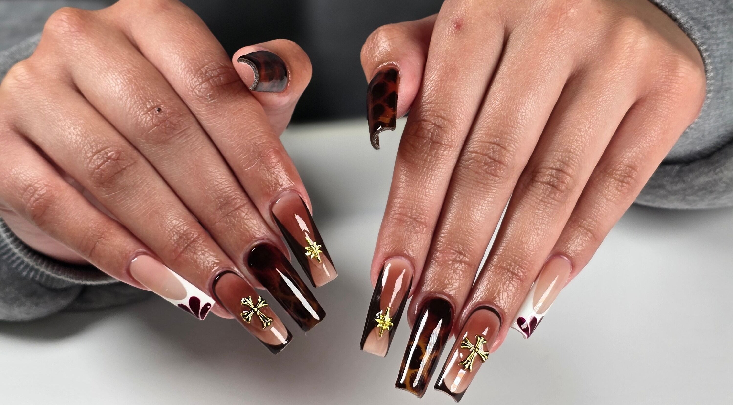 Elegant nail art with gold accents at Chloe Studio Nail by Sophie, Garden Grove, California, US.