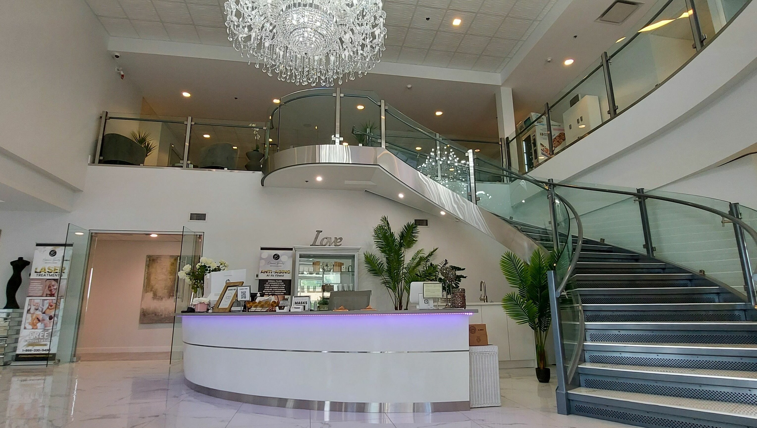 Luxurious modern entrance at K-BTS Main Shop, Calgary, Alberta, CA featuring chic decor and grand staircase.