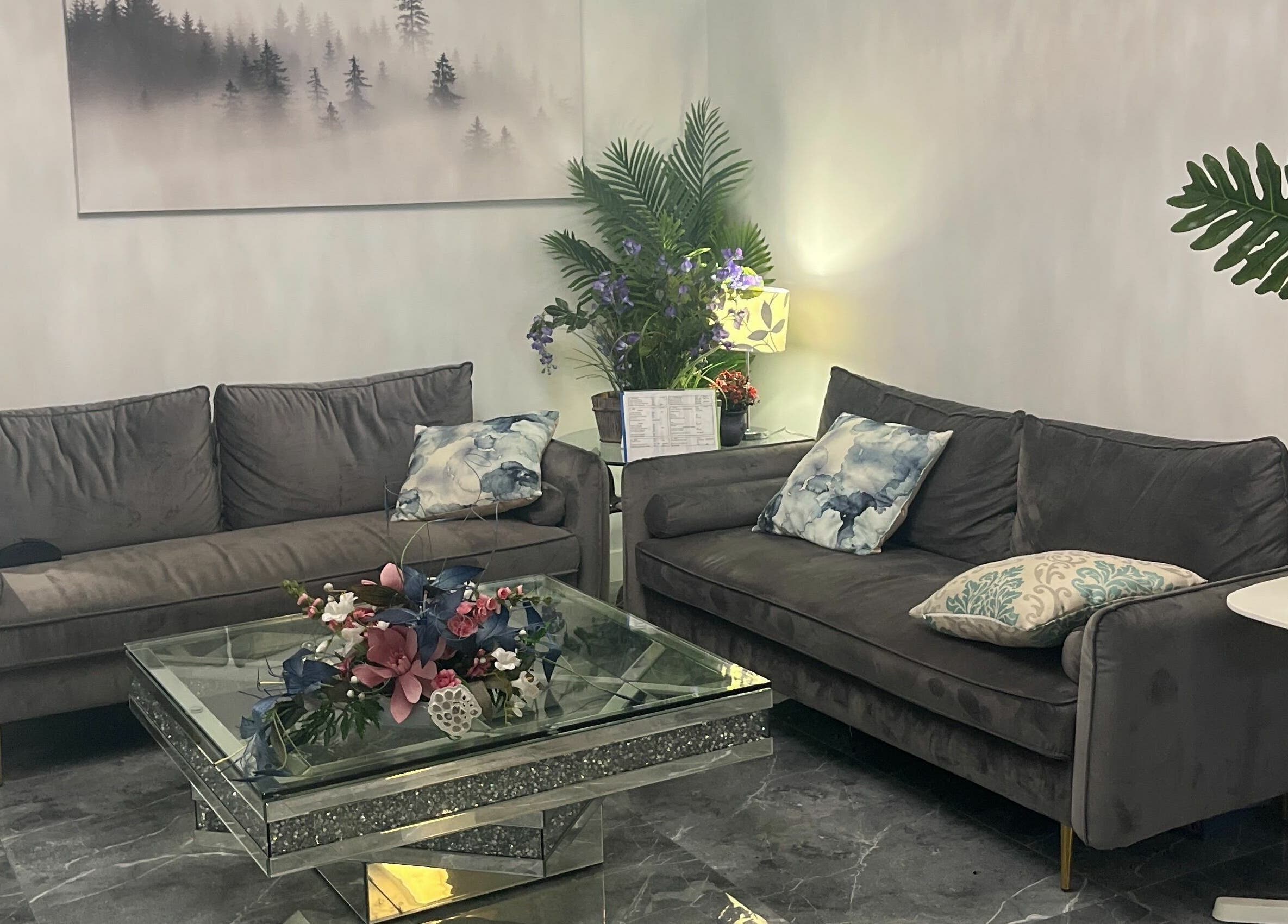 Elegant lounge with plush sofas at K-BTS Main Shop, Calgary, Alberta, CA. Perfect for relaxation and style.