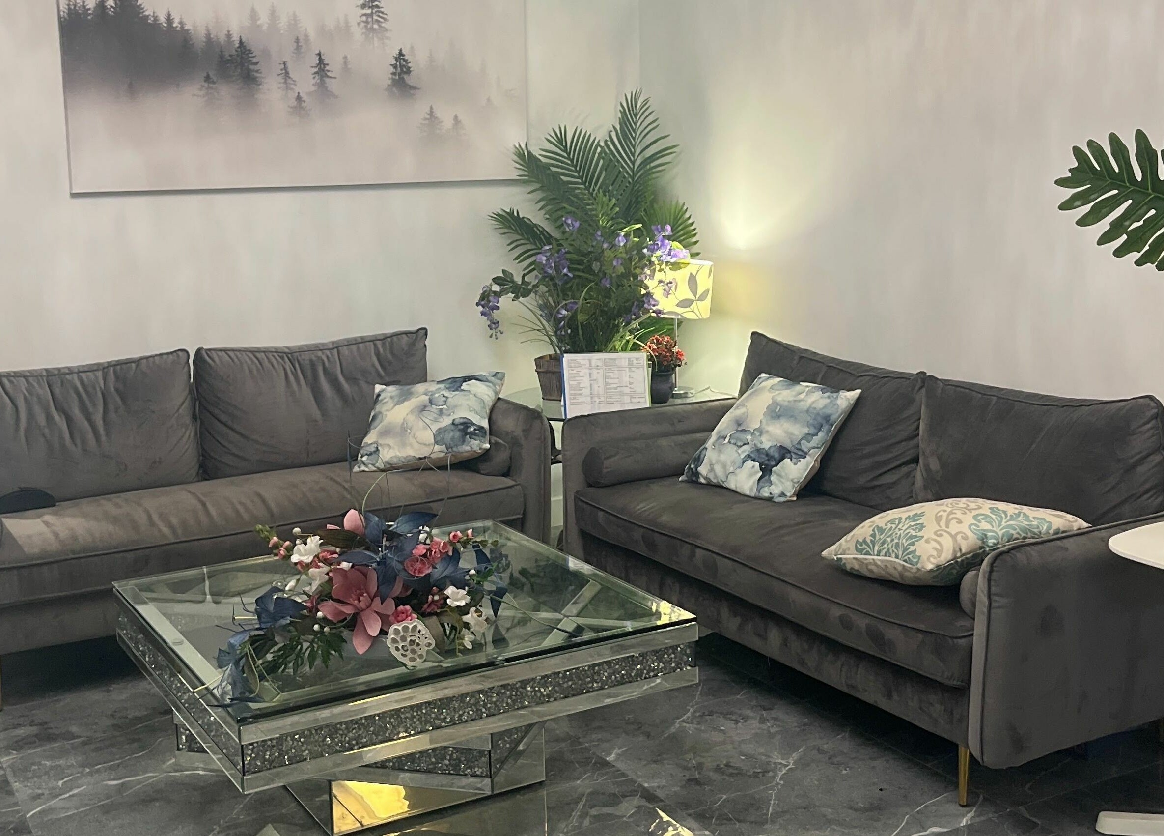 Elegant lounge with plush sofas at K-BTS Main Shop, Calgary, Alberta, CA. Perfect for relaxation and style.