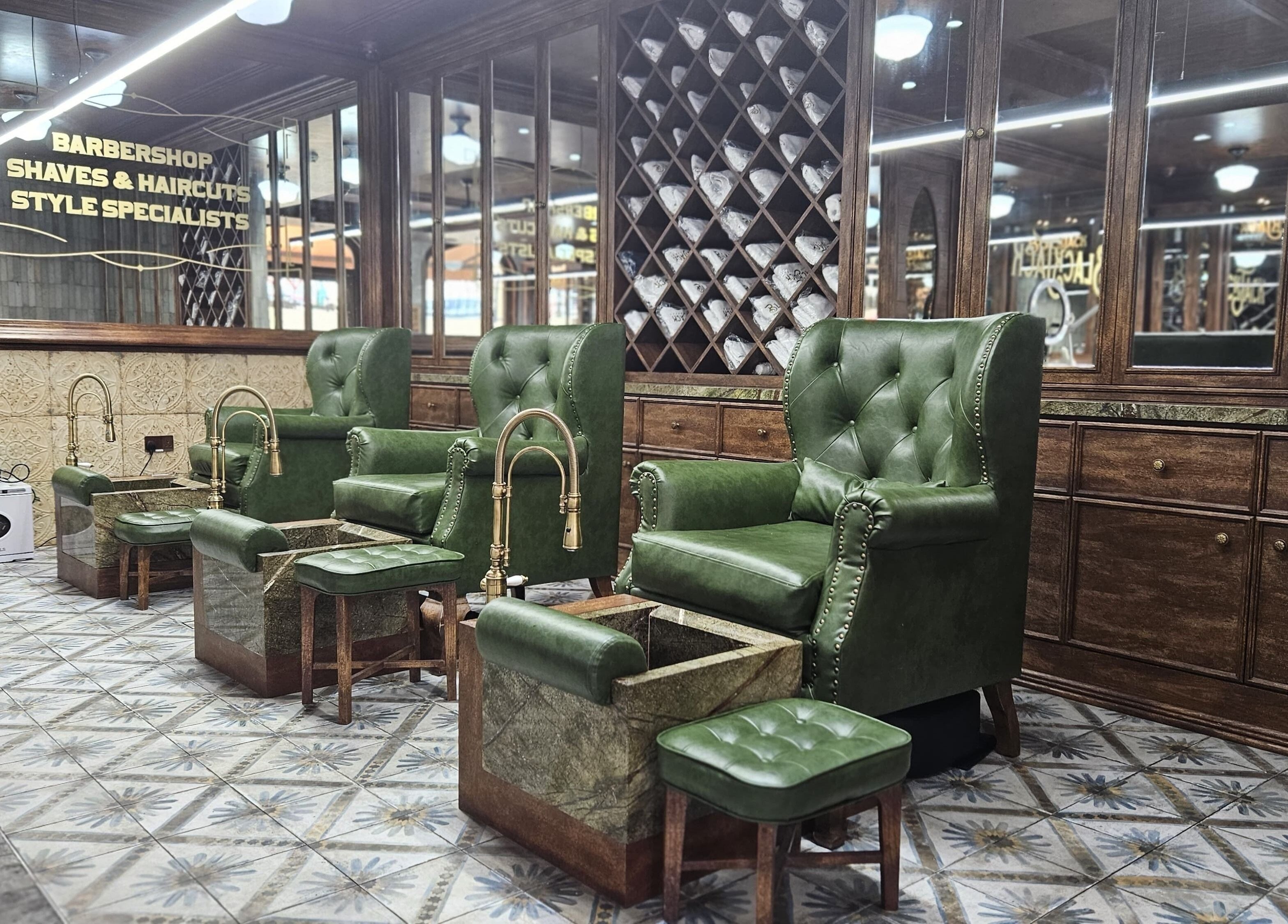 Elegant green chairs at JBR BlackJack Barbershop in Dubai, Dubai, AE showcase a vintage barber style.
