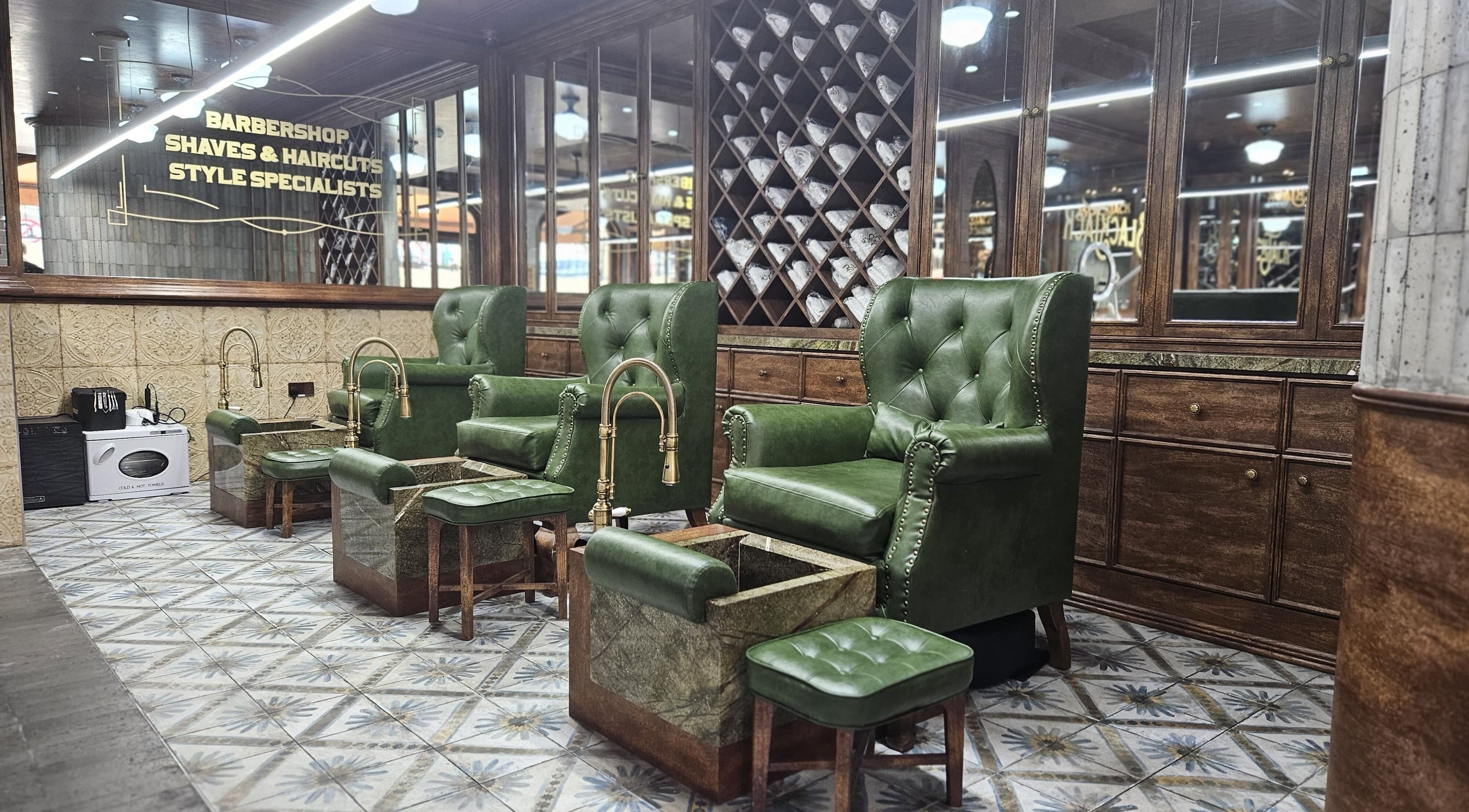 Elegant green chairs at JBR BlackJack Barbershop in Dubai, Dubai, AE showcase a vintage barber style.