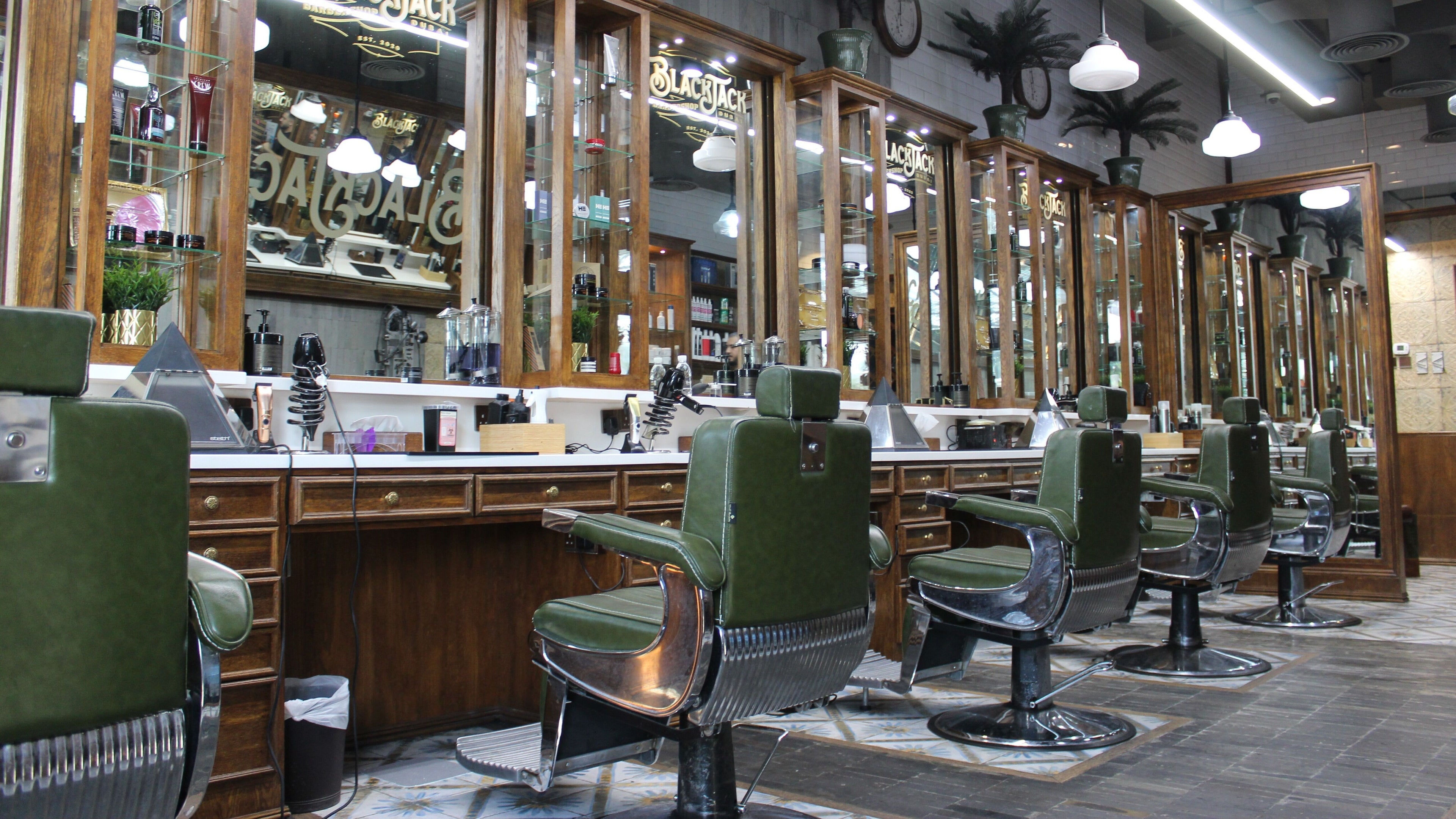 Interior of JUMEIRAH 3 BLACK JACK BARBER SHOP, Dubai, Dubai, AE showcasing elegant barber chairs and mirrors.
