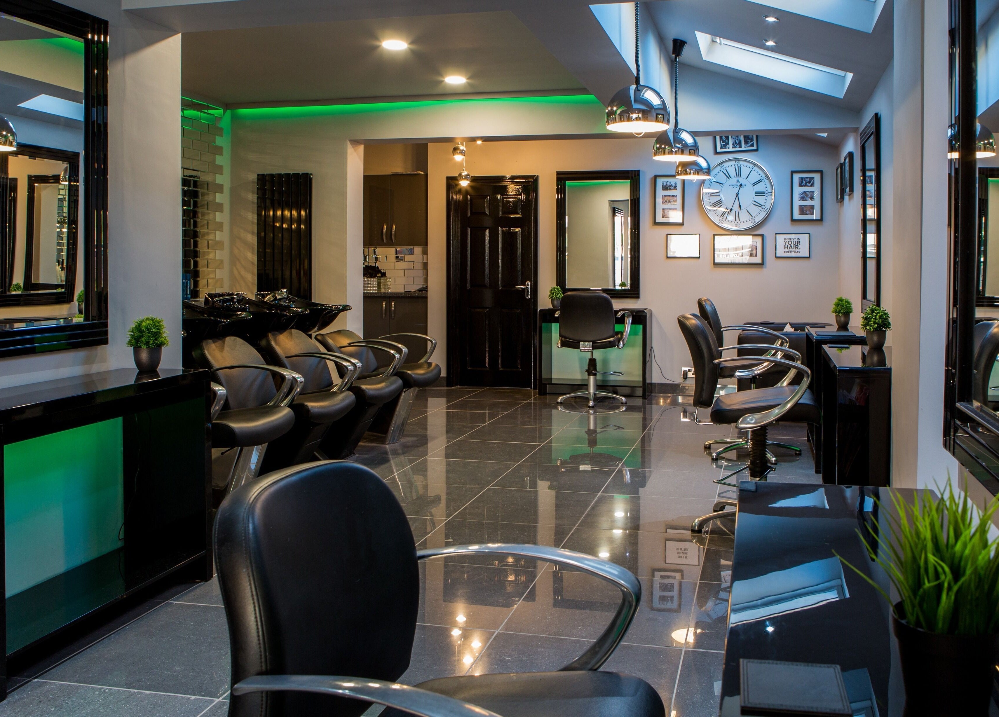 Elegant interior of CODE Hair Consultants in Lowestoft, England, GB, showcasing modern salon chairs and decor.