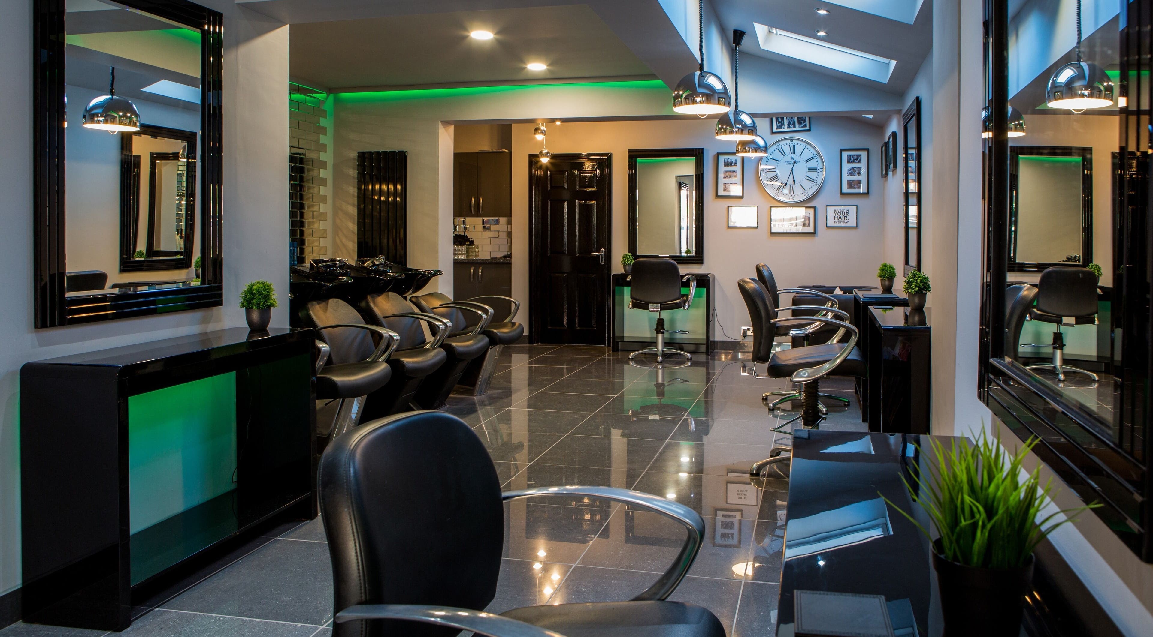 Elegant interior of CODE Hair Consultants in Lowestoft, England, GB, showcasing modern salon chairs and decor.