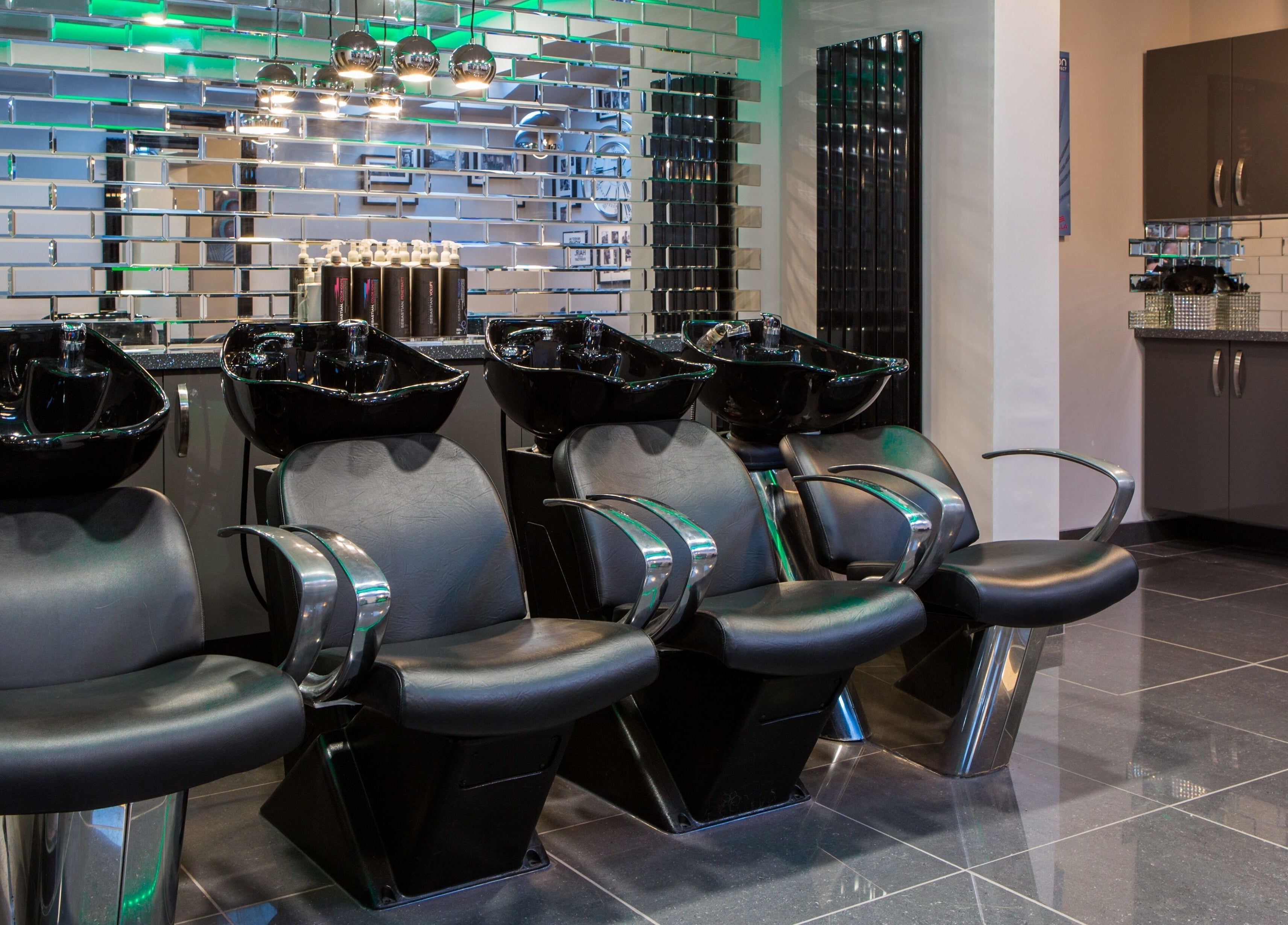Modern hair wash stations at CODE Hair Consultants in Lowestoft, England, GB, showcasing sleek design.