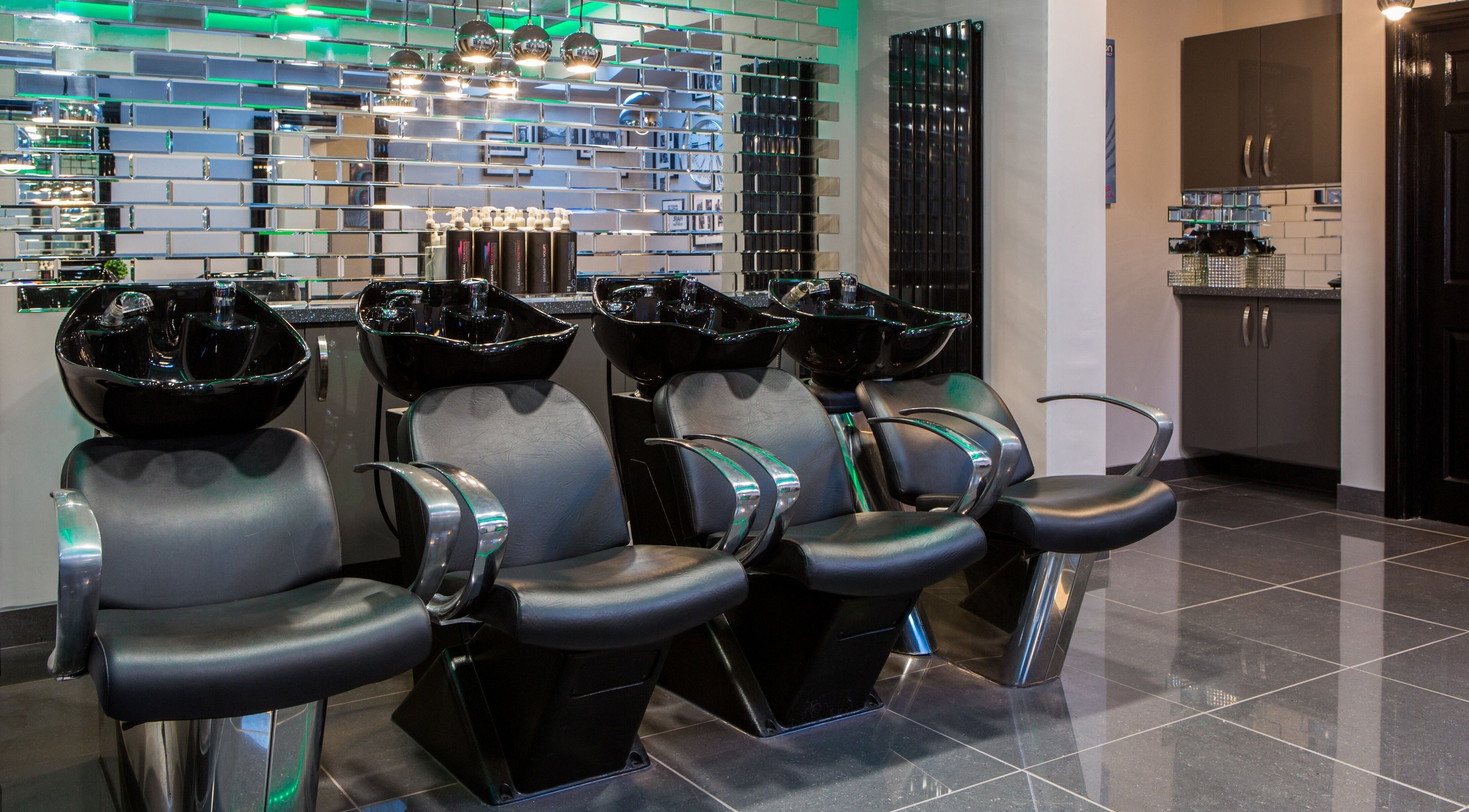 Modern hair wash stations at CODE Hair Consultants in Lowestoft, England, GB, showcasing sleek design.