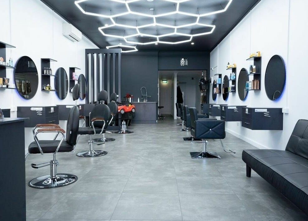 Inside 3 Points Hair Extensions and Barbering, Melbourne, Victoria, AU: sleek chairs, mirrors, and ambient lighting.