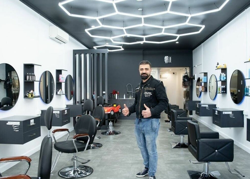 Modern interior of 3 Points Hair Extensions and Barbering in Melbourne, Victoria, AU, featuring sleek design and styling chairs.