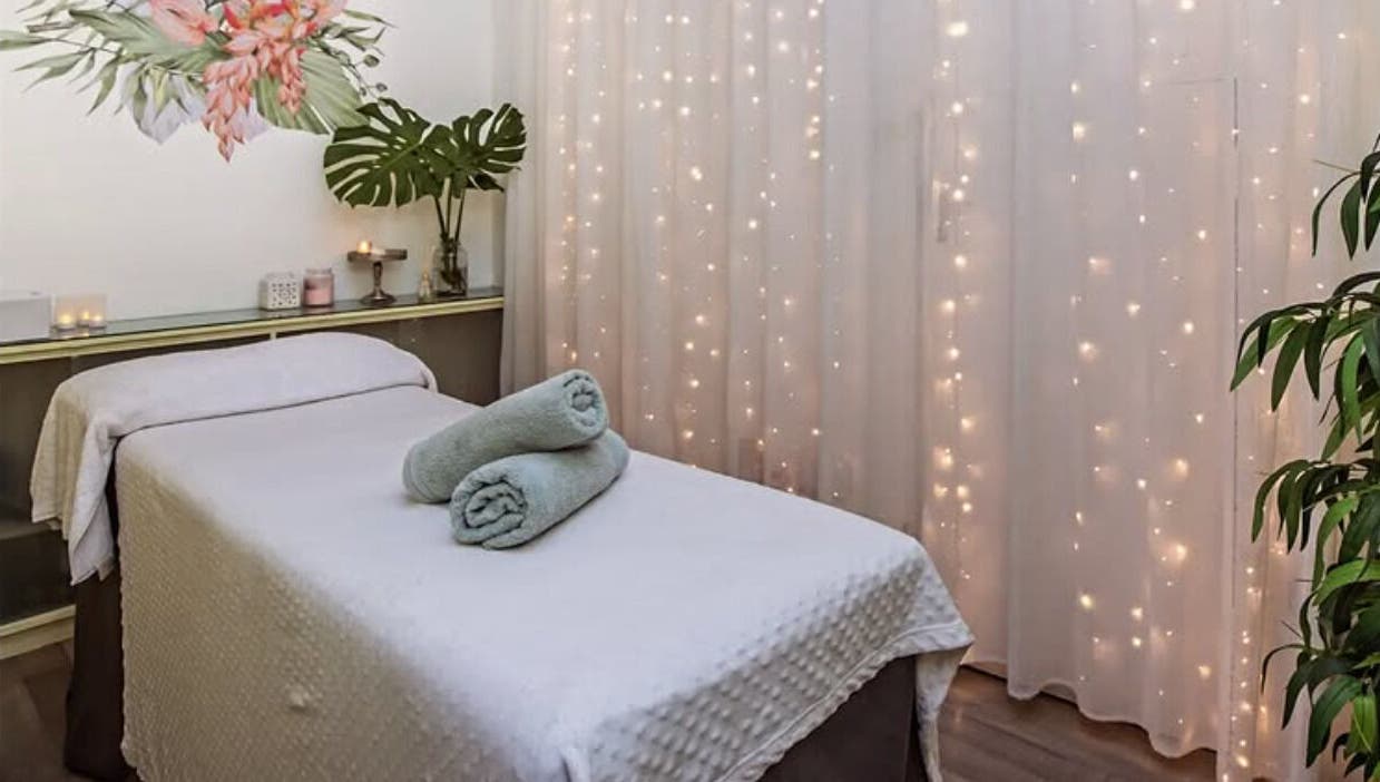 Relaxing massage room at Flourish Salon, Durban North, KwaZulu-Natal, ZA, featuring soft lighting and decor.