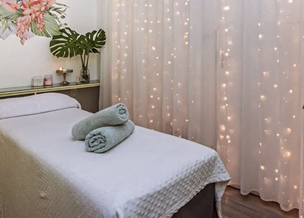 Relaxing massage room at Flourish Salon, Durban North, KwaZulu-Natal, ZA, featuring soft lighting and decor.