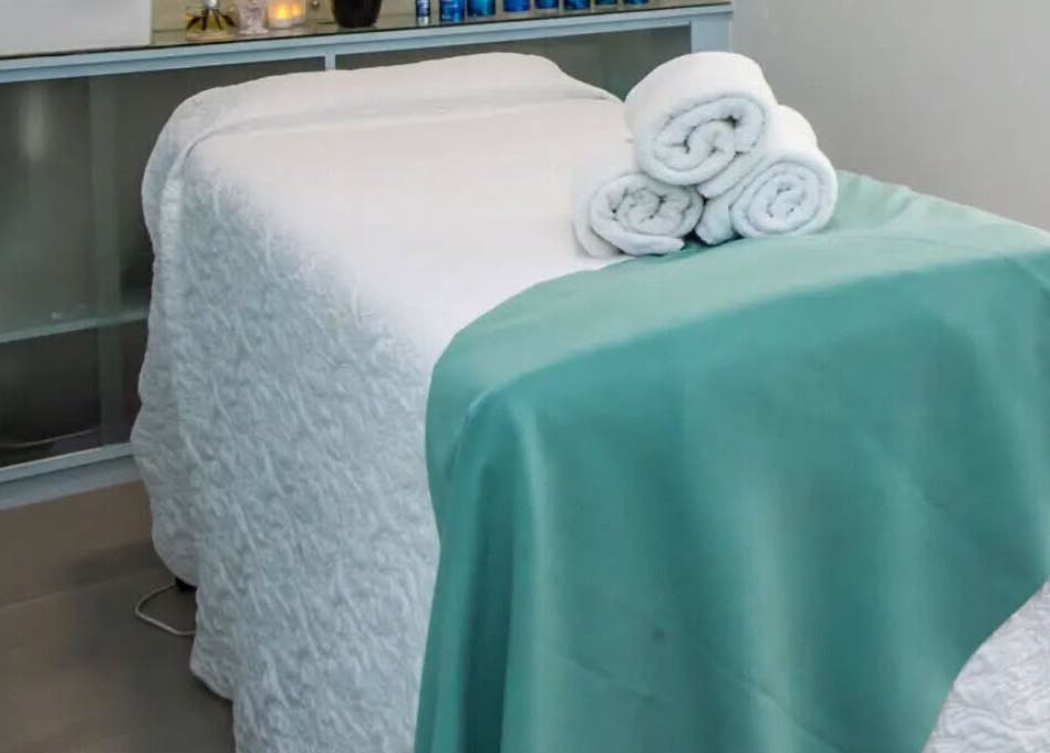 Serene massage bed setup at Flourish Salon in Durban North, KwaZulu-Natal, ZA, ready for a calming experience.
