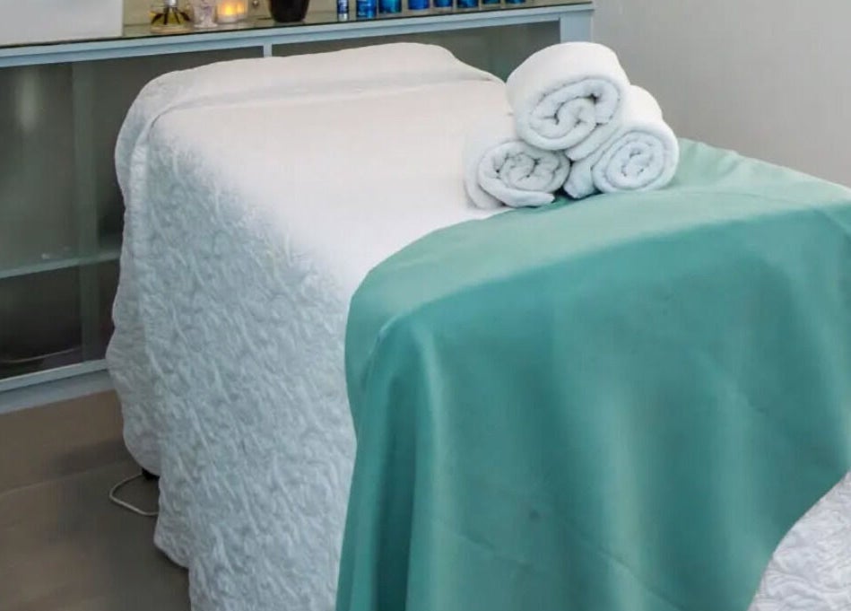 Serene massage bed setup at Flourish Salon in Durban North, KwaZulu-Natal, ZA, ready for a calming experience.