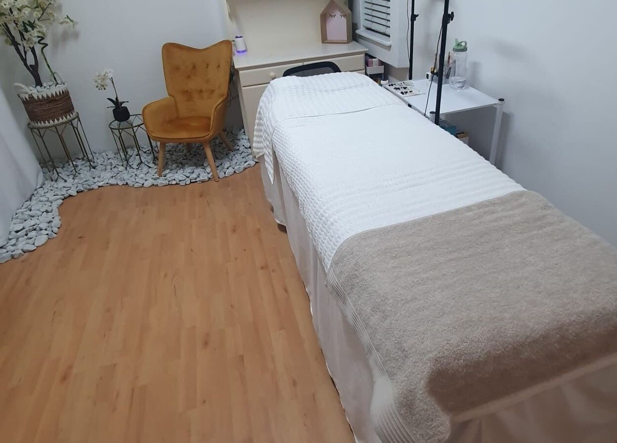 Relaxing treatment room at Flourish Salon, Durban North, KwaZulu-Natal, ZA, with chair and massage table.