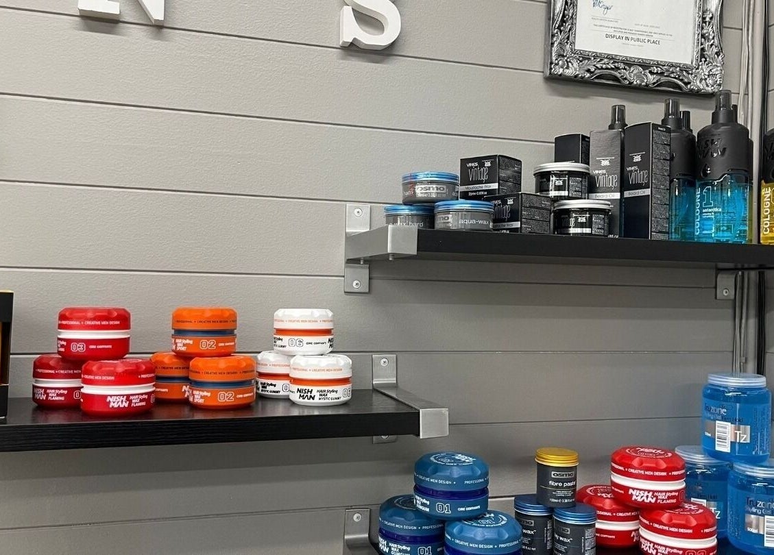 Hair styling products on display shelves at Gentlemen's Barbers Hamilton, Waikato, NZ.