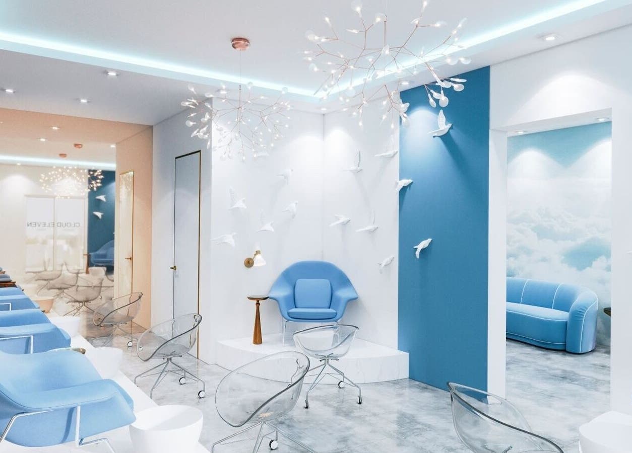 Chic interior of Cloud Eleven Beauty Salon in Dubai, Dubai, AE, with modern blue and white decor.