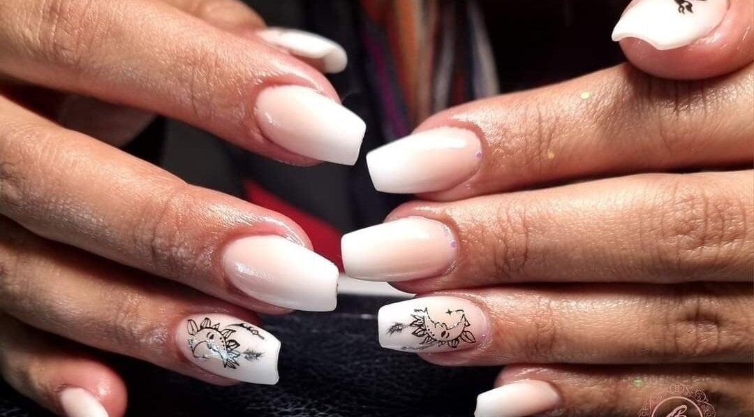 Nail art with white polish at Gemini Beauty Studio, Cape Town, Western Cape, ZA.