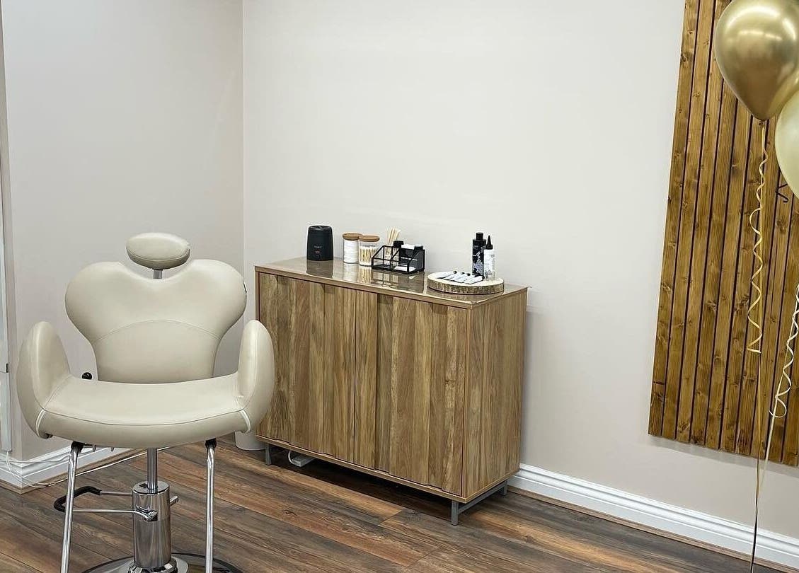 Comfortable salon chair at Repose Beauty and Wellbeing, Macclesfield, England, GB, with elegant decor.