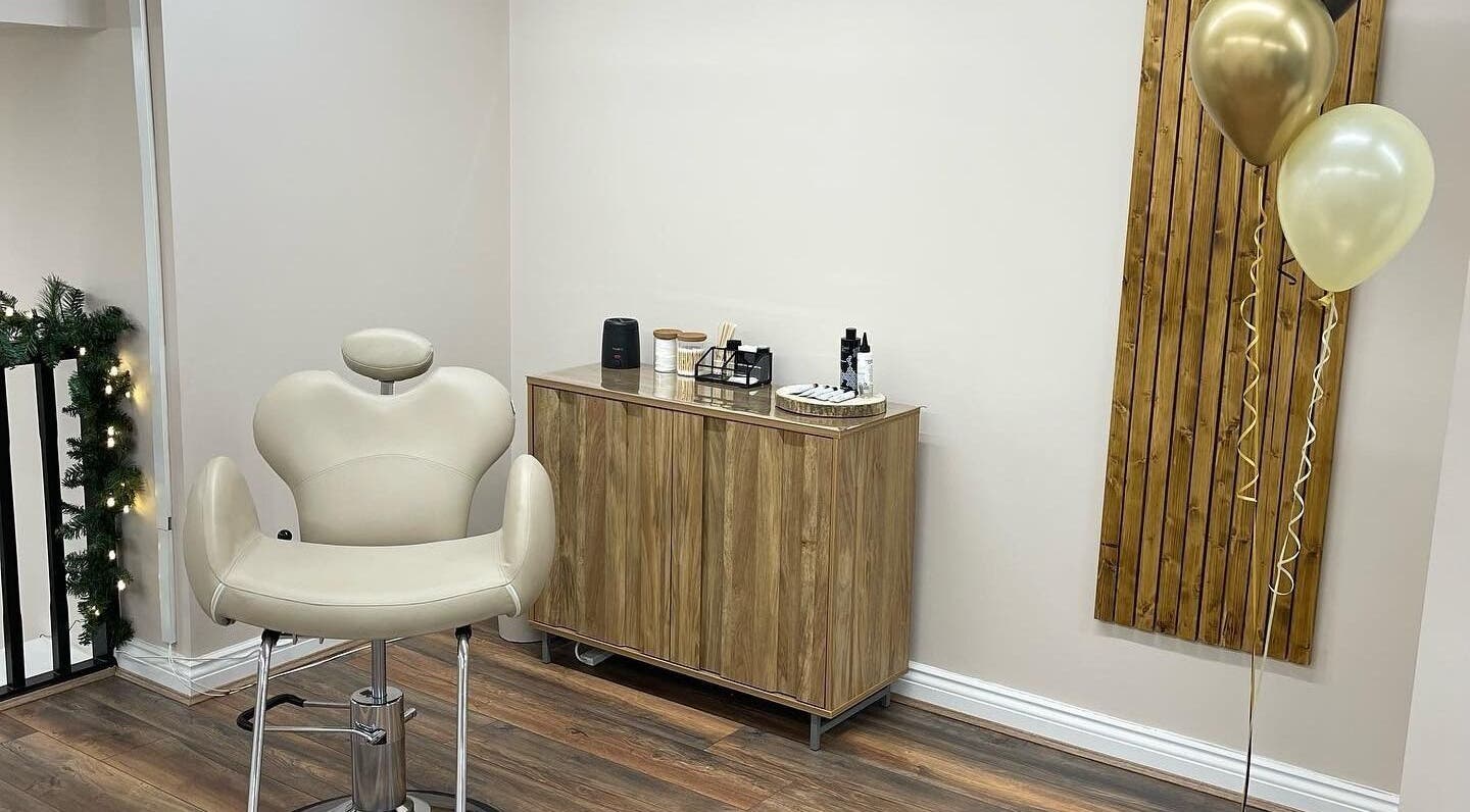 Comfortable salon chair at Repose Beauty and Wellbeing, Macclesfield, England, GB, with elegant decor.
