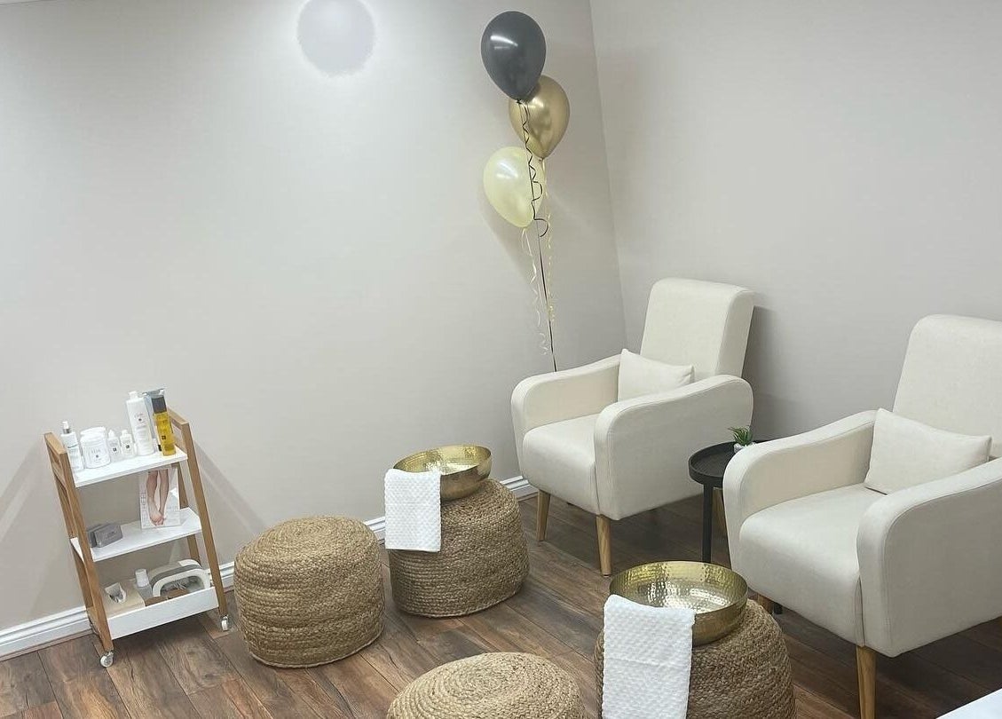 Comfortable lounge space at Repose Beauty and Wellbeing, Macclesfield, England, GB, with chairs and decor.