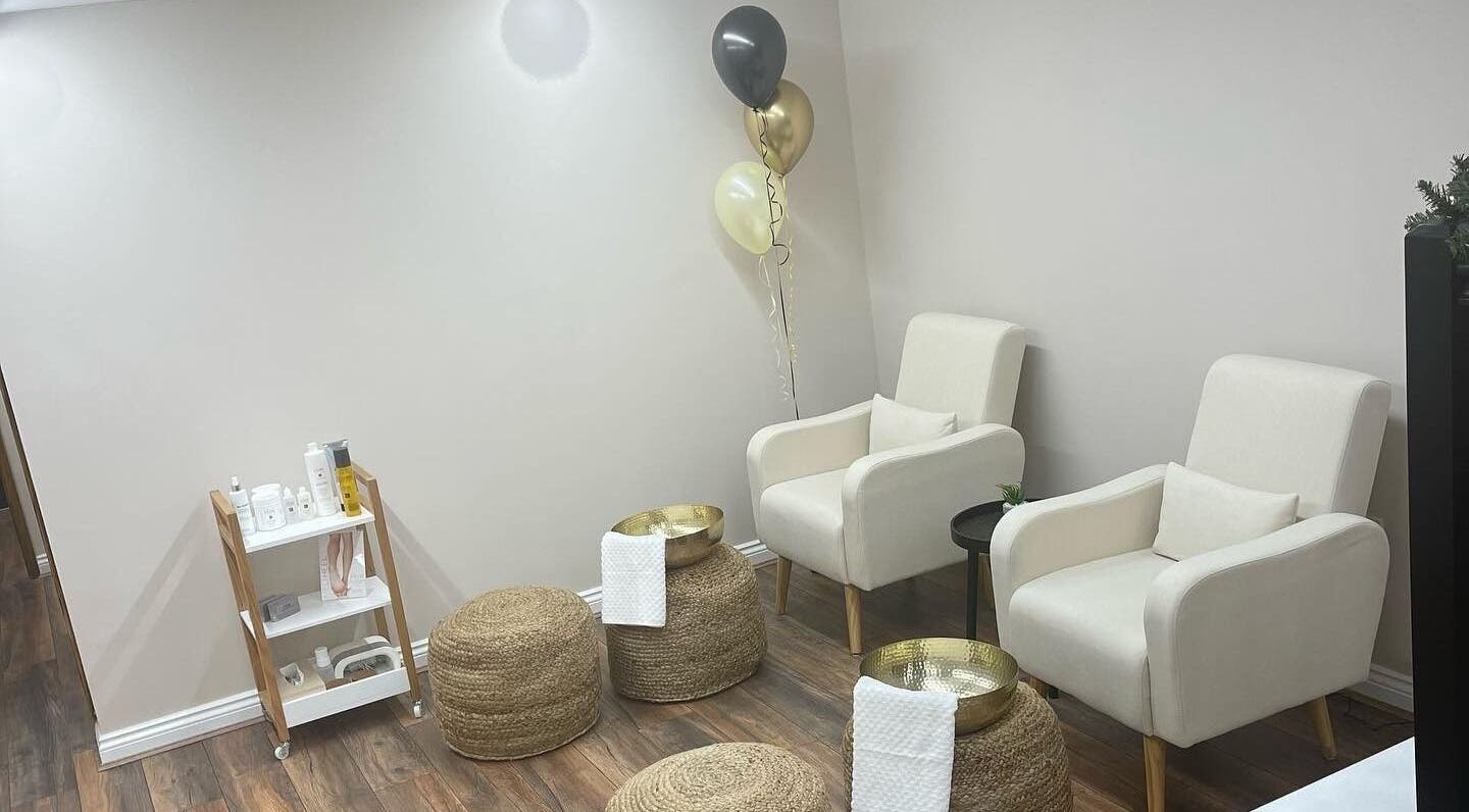 Comfortable lounge space at Repose Beauty and Wellbeing, Macclesfield, England, GB, with chairs and decor.