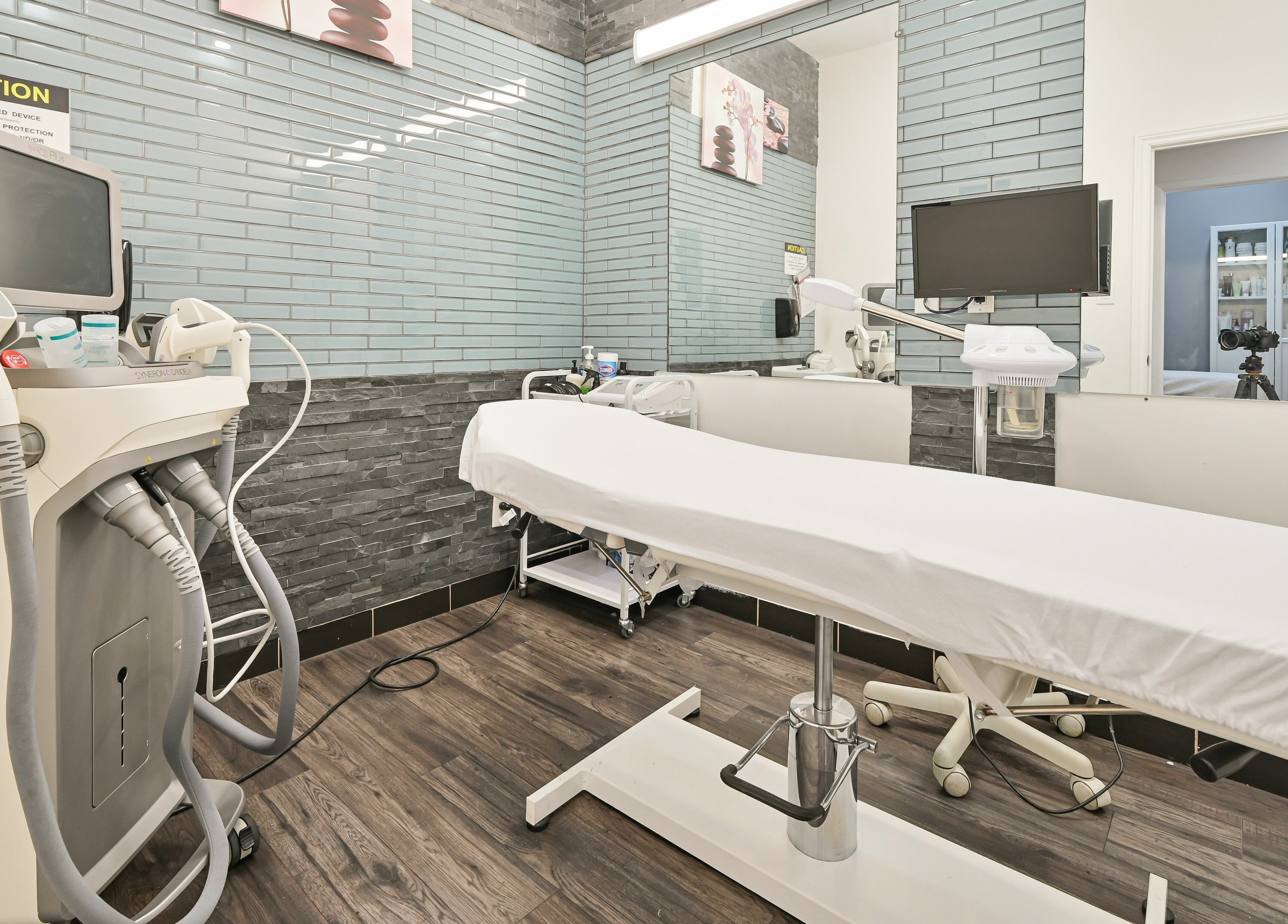 Modern treatment room at VU Salon and Spa, Mississauga, Ontario, CA featuring advanced equipment and clean design.