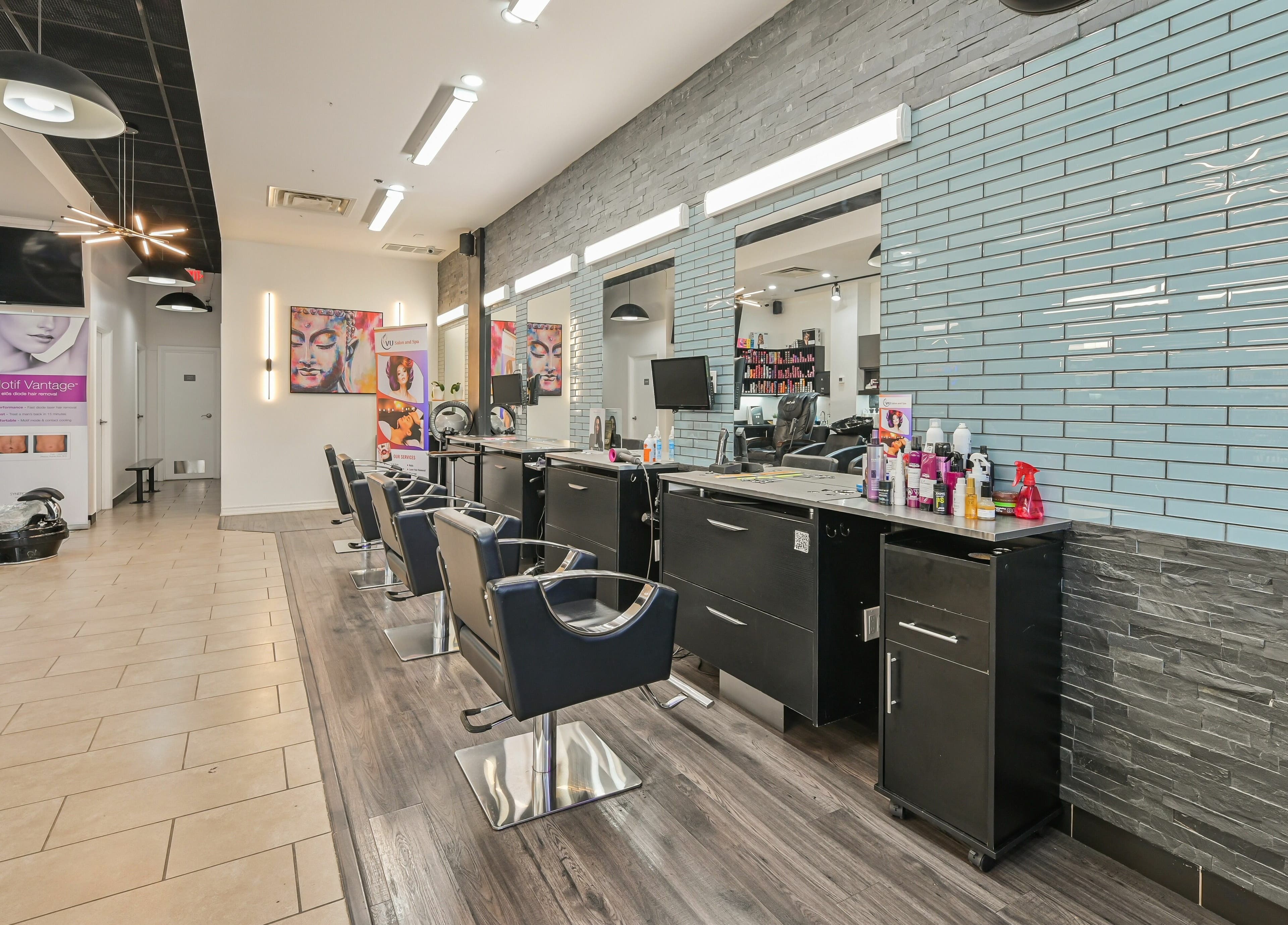 Modern interior of VU Salon and Spa in Mississauga, Ontario, CA showcasing hair styling stations.