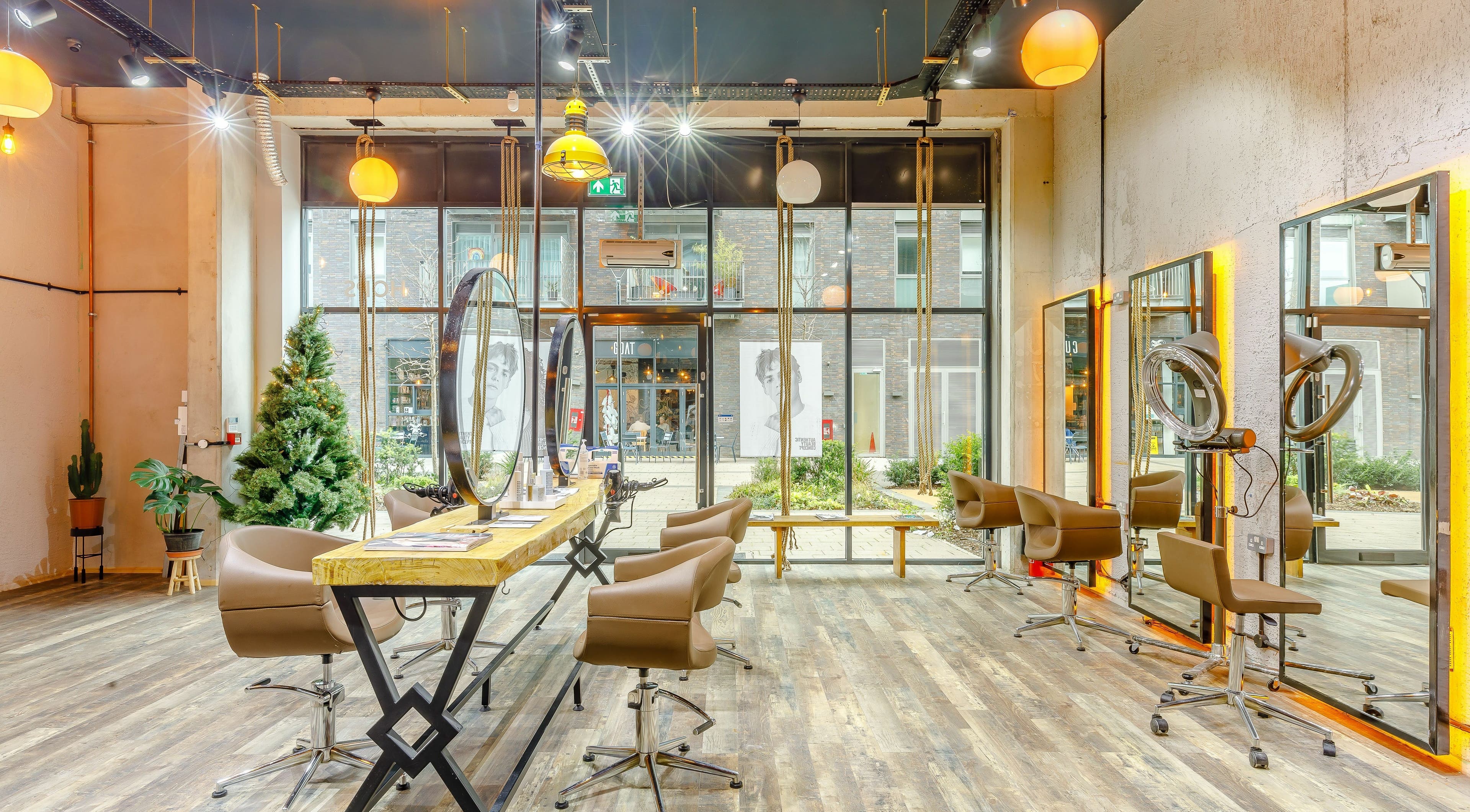 Bright, modern interior of Hops London in London, England, GB with stylish chairs and mirrors.
