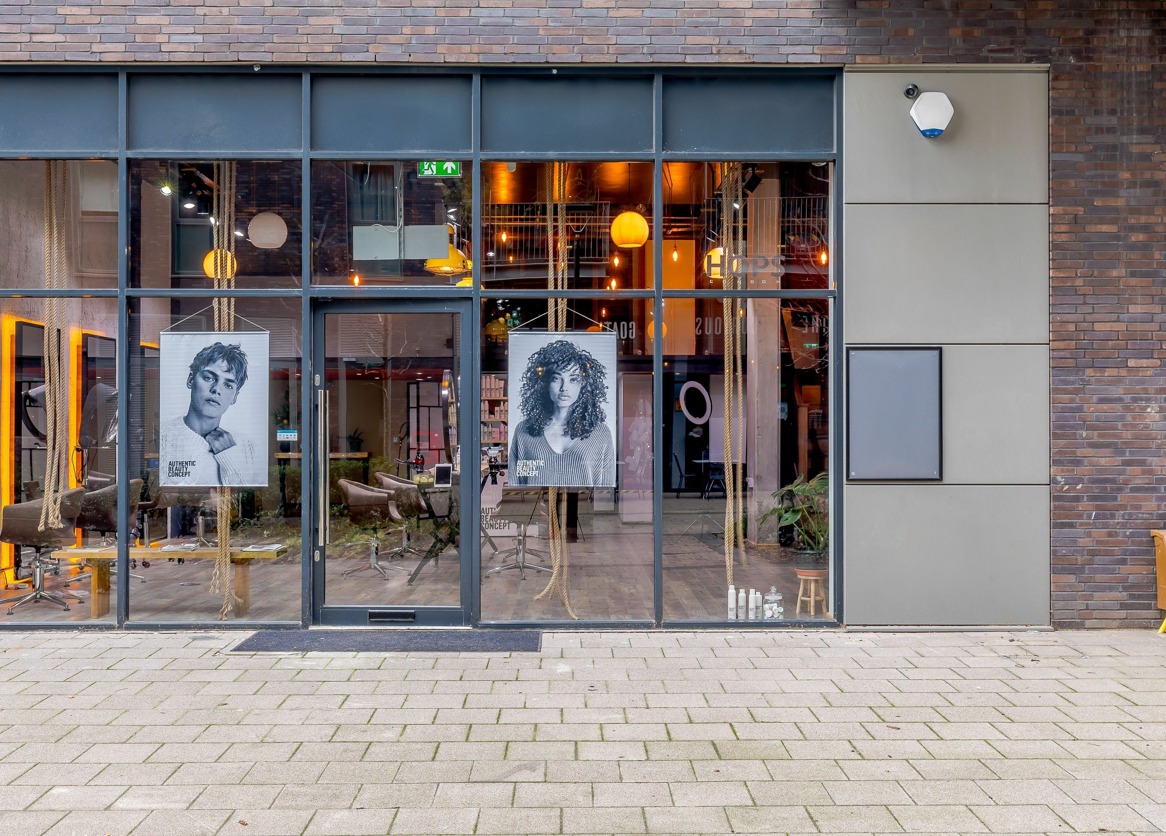 Hops London venue facade with sleek glass entrance in London, England, GB, showcasing elegant salon interiors.