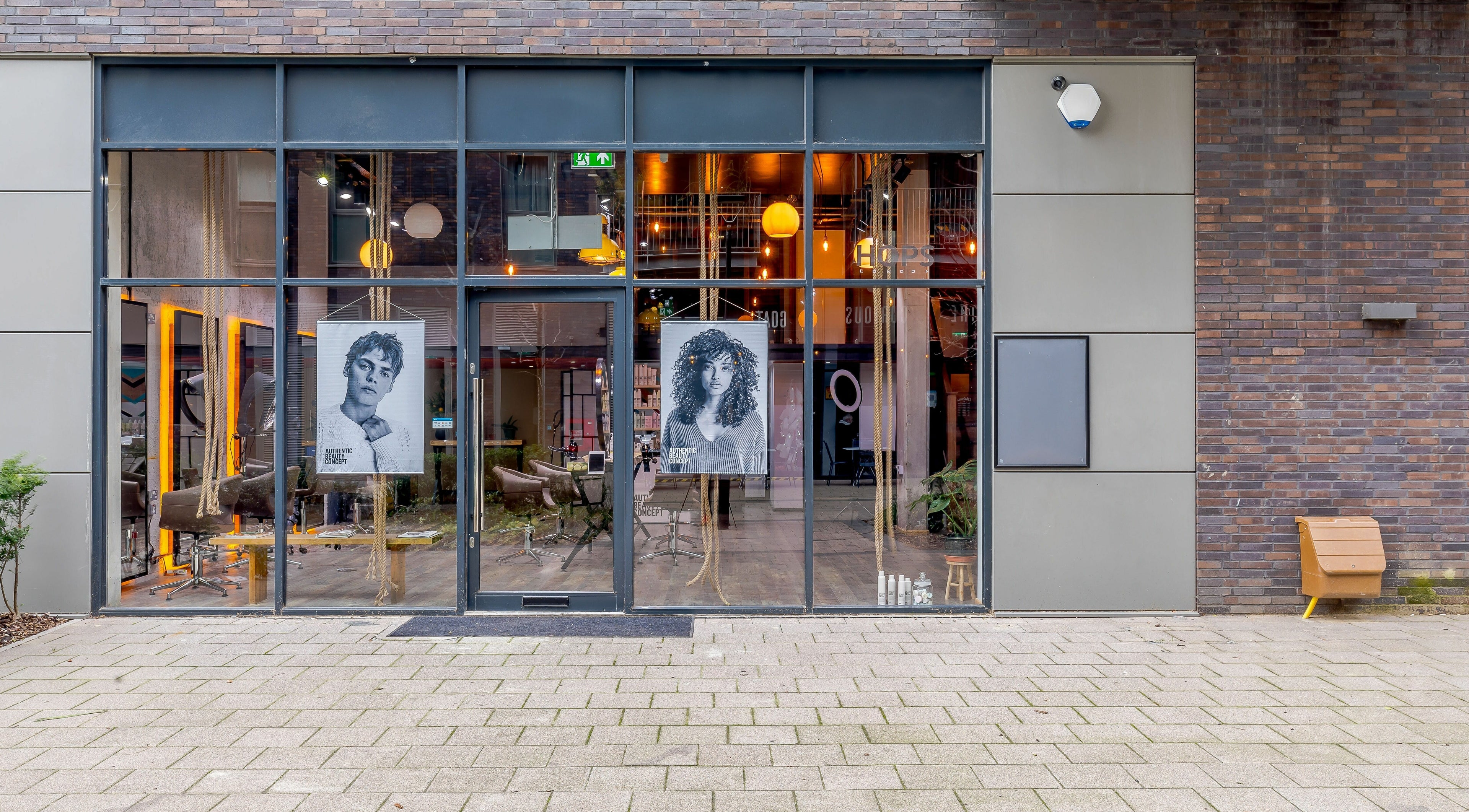 Hops London venue facade with sleek glass entrance in London, England, GB, showcasing elegant salon interiors.