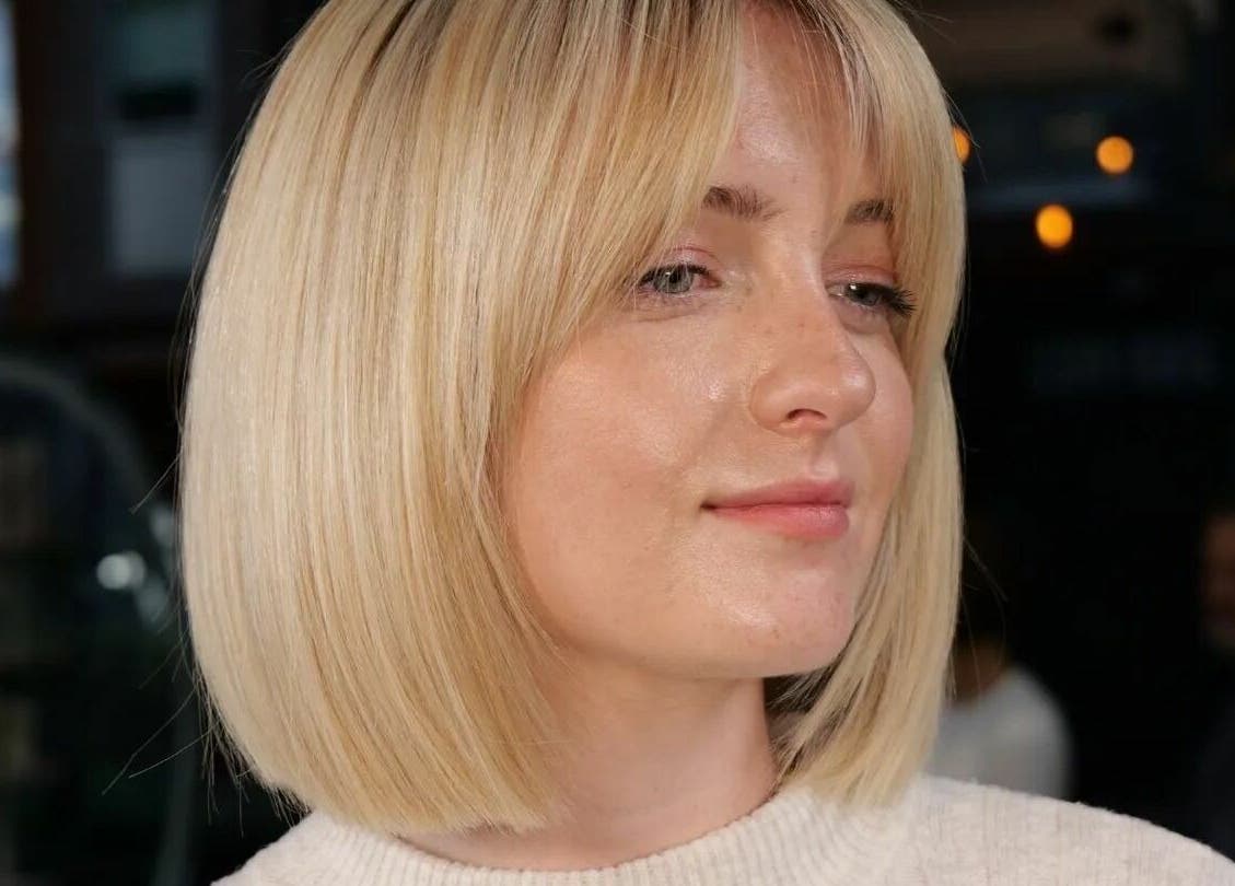 Woman with sleek blonde bob hairstyle at Hops London, London, England, GB, showcasing modern hair trends.