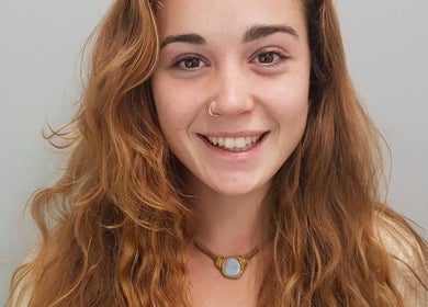 Smiling person with vibrant hair, representing the beauty services at Melinda Vrees, Melbourne, Victoria, AU.