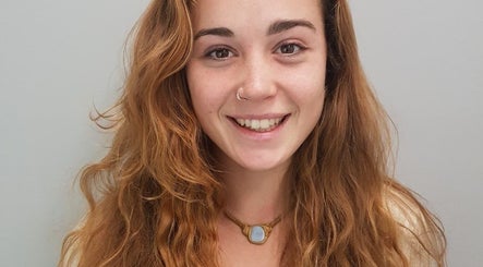 Smiling person with vibrant hair, representing the beauty services at Melinda Vrees, Melbourne, Victoria, AU.