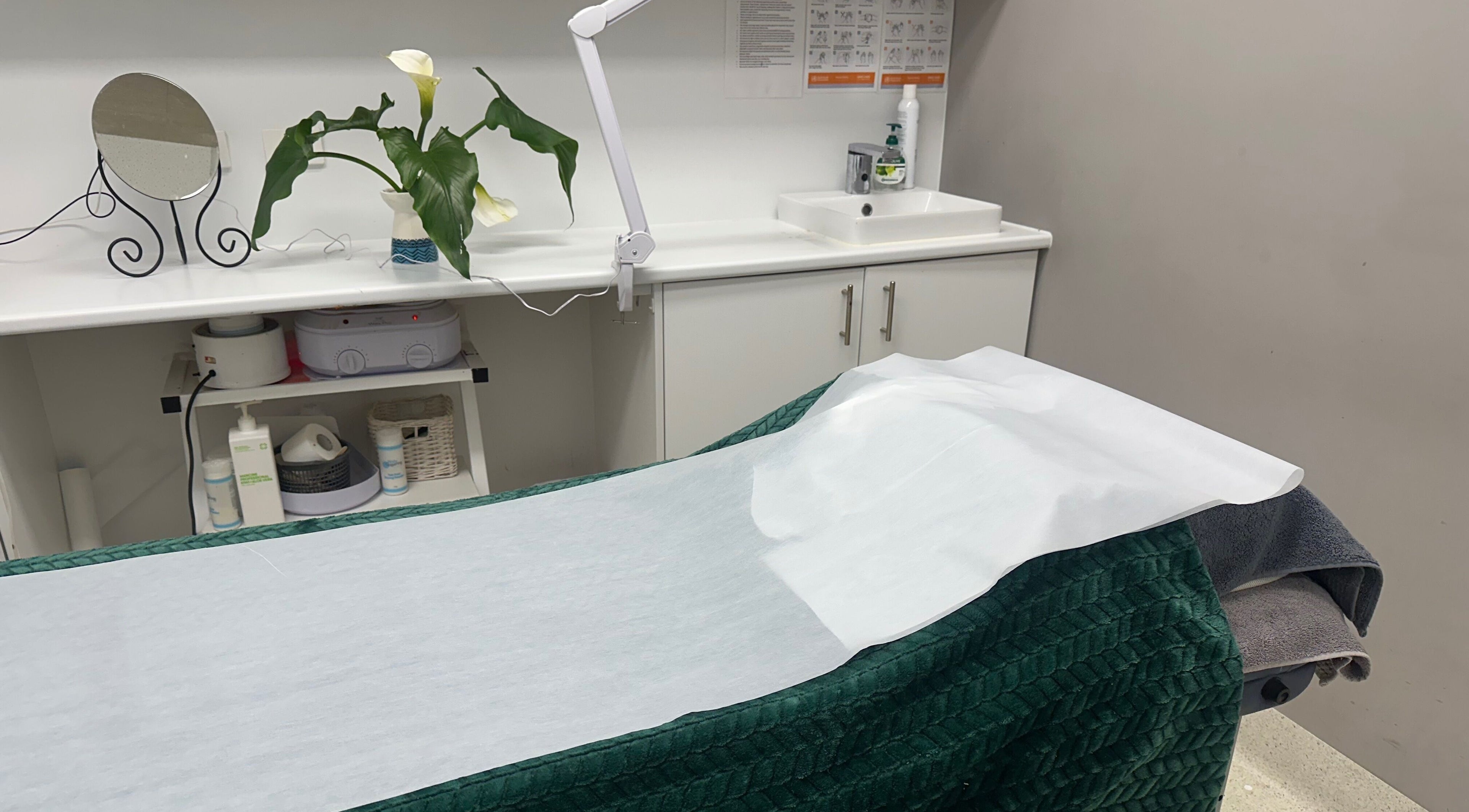 Serene treatment room at Westgarth Beauty, Melbourne, Victoria, AU, featuring a massage table and decor.