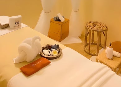 Relaxing spa treatment room at Aora Spa and Wellness Jitra, Jitra, Kedah, MY, featuring a neatly arranged bed.