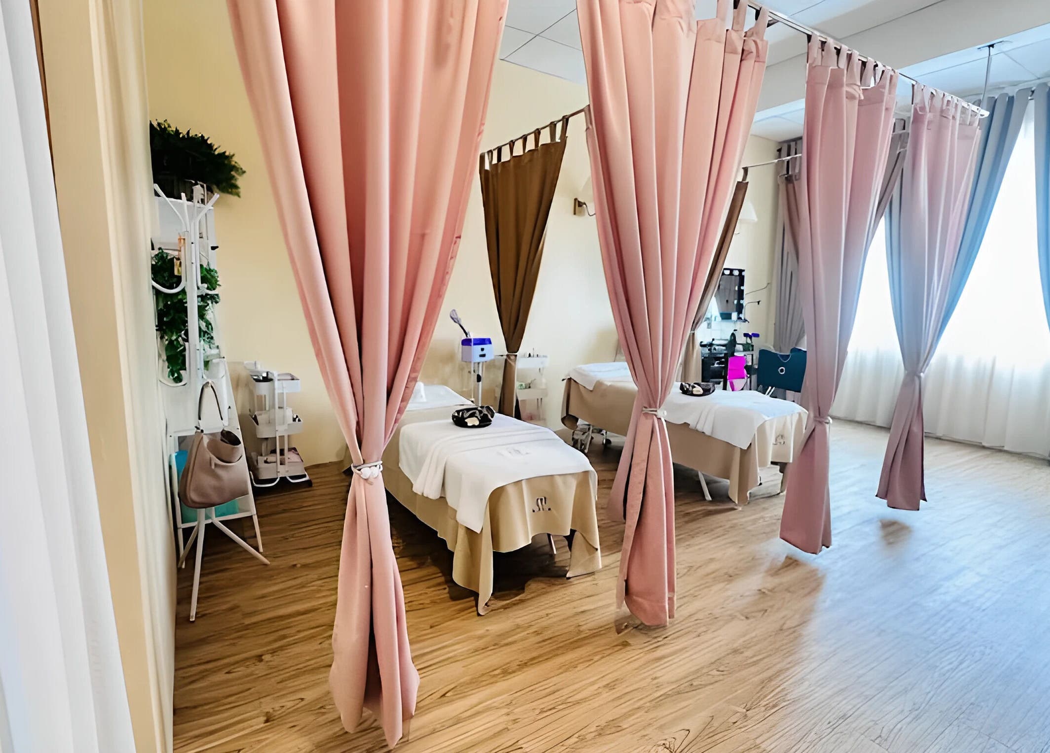 Treatment beds at Aora Spa and Wellness Jitra, Jitra, Kedah, MY highlighted by elegant curtains.