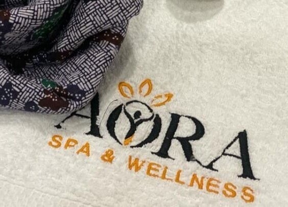 Aora Spa and Wellness Port Dickson logo on a soft towel in Port Dickson, Negeri Sembilan, MY.