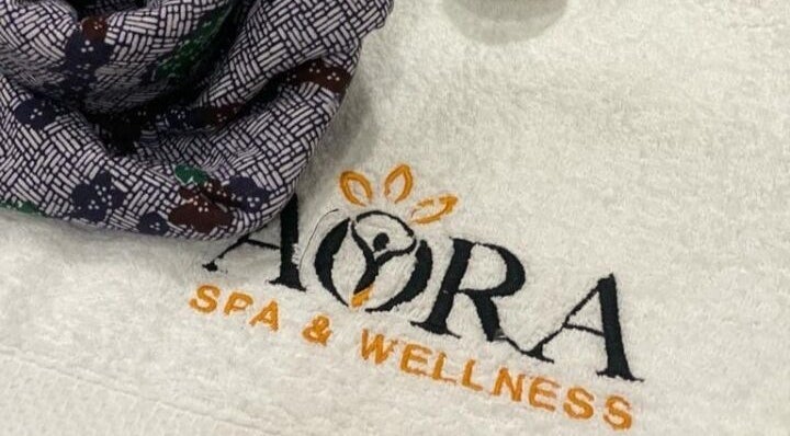 Aora Spa and Wellness Port Dickson logo on a soft towel in Port Dickson, Negeri Sembilan, MY.