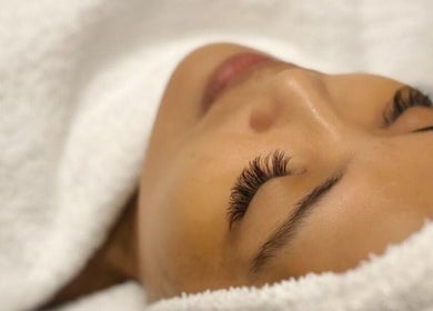 Relaxed woman enjoys facial treatment at Aora Spa and Wellness Seremban Negeri Sembilan, Seremban, Negeri Sembilan, MY.