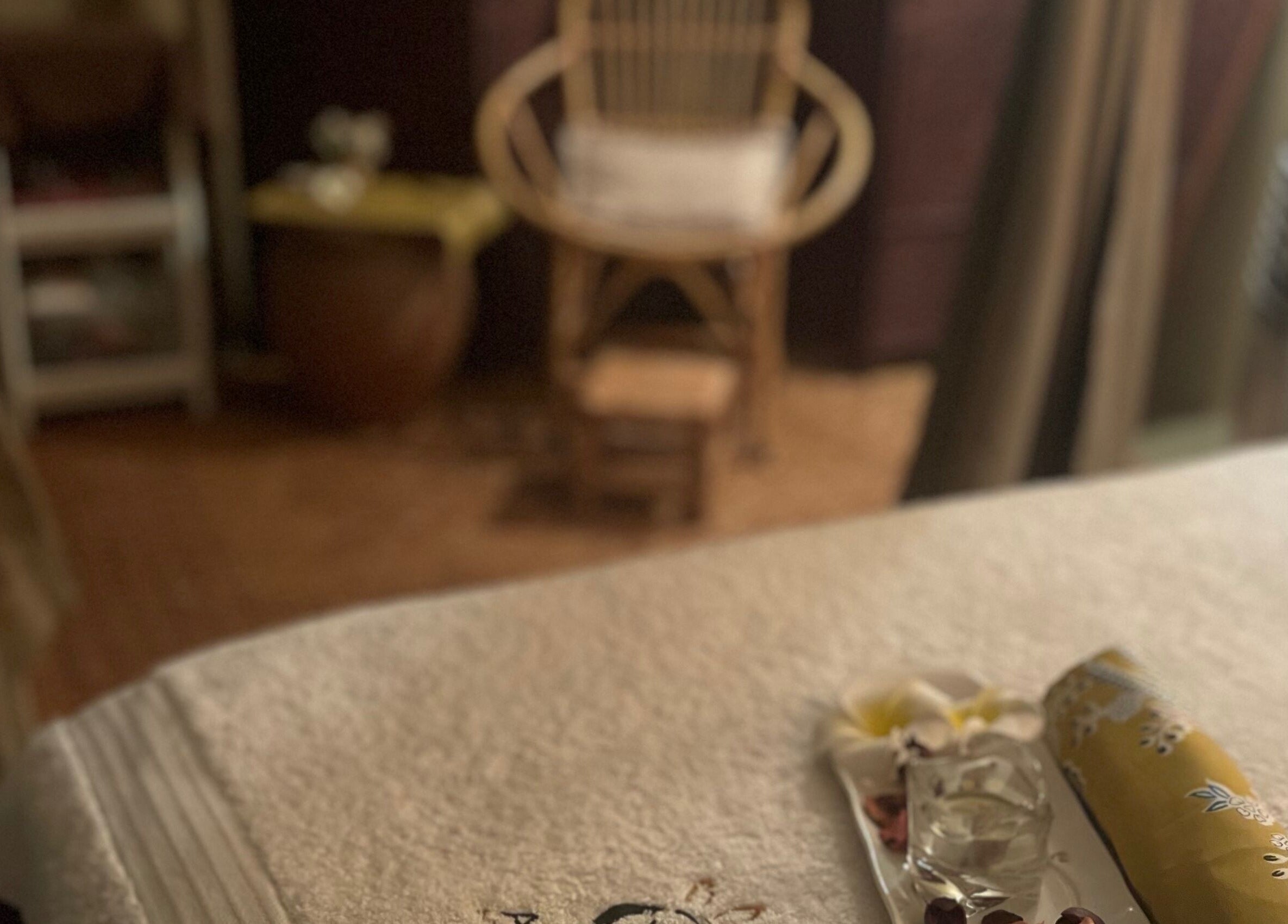 A peaceful setting at Aora Spa and Wellness - Lumut featuring a cozy massage table and chair in Lumut, Perak, MY.